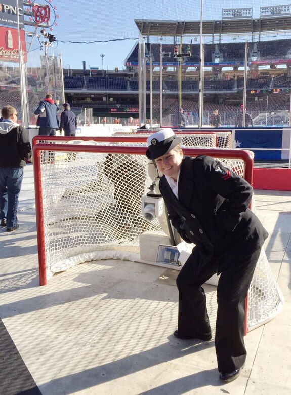 Navy Petty Officer 2nd Class Colleen Dibble, a master-at-arms assigned to Naval Support Activity Bethesda, Md., attends the 2015 Bridgestone NHL Winter Classic at Nationals Park in Washington between the Chicago Blackhawks and the Washington Capitals, Jan. 1, 2015. Dibble will re-enlist at a Washington Capitals game in April. Courtesy photo