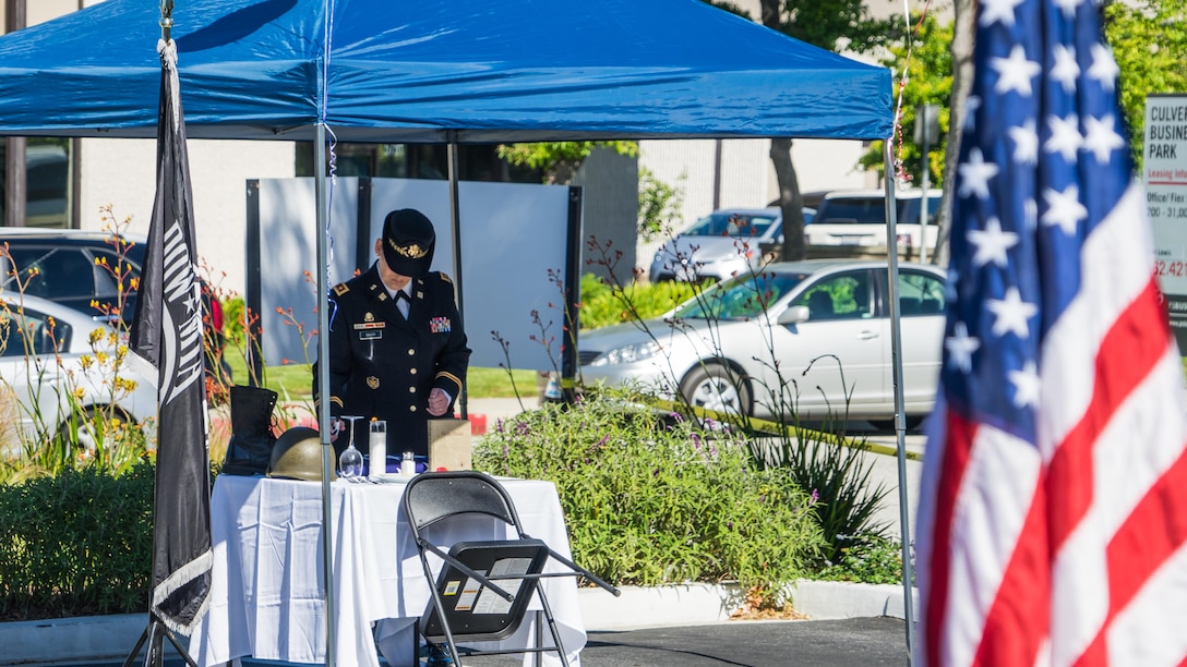 Maj. (Retired) Andrea Singer conducts the Missing Man Table and Honors Ceremony during the 50th Anniversary Commemoration of the Vietnam War at the West Los Angeles Vet Center, Culver City, Calif., March 29, 2016.