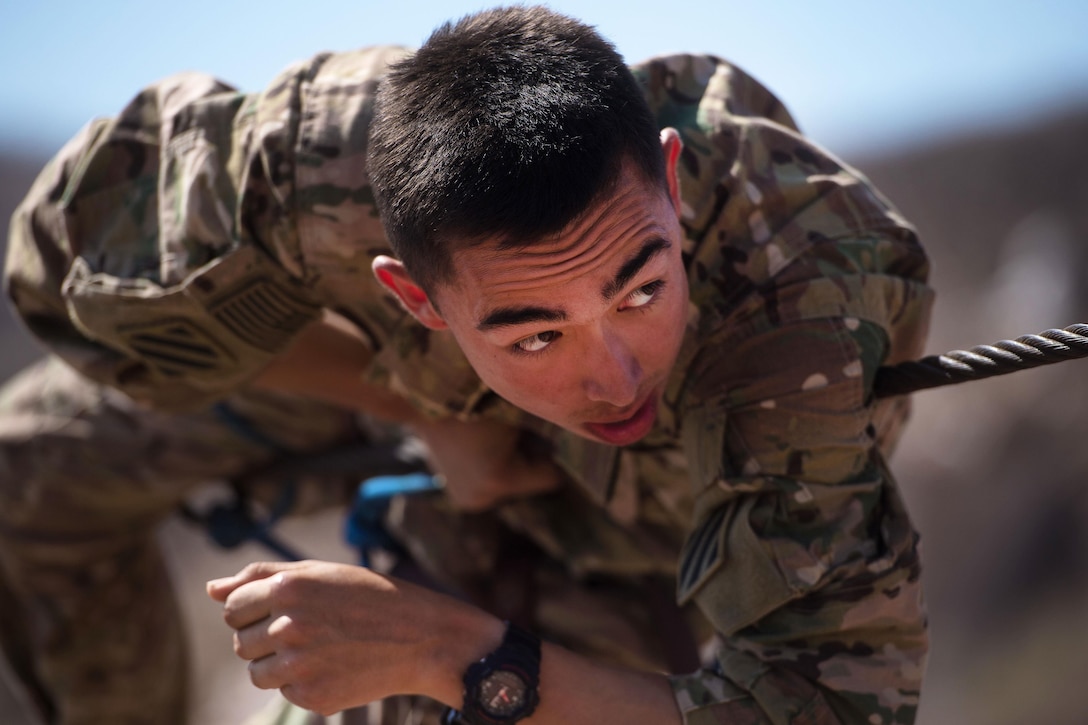 A U.S. soldier negotiates a rope obstacle during a desert commando course in Arta, Djibouti, March 15, 2016. Air Force photo by Tech. Sgt. Barry Loo