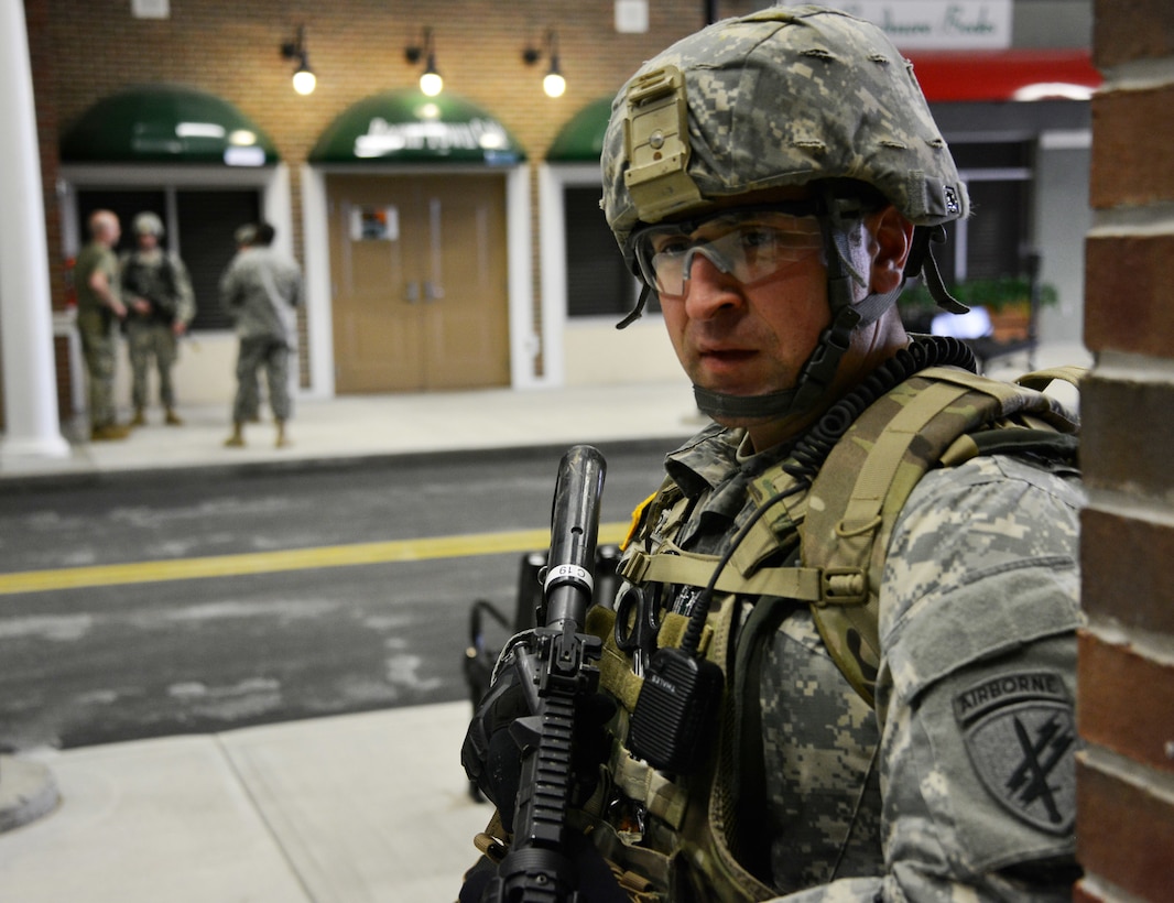 UTICA, NEW YORK – Sgt. Adam D. Francis, a combat medic with Bravo Company 403rd Civil Affairs Battalion, pulls security during a key leader engagement during Exercise Oriskany on March 13, 2016 at the New York State Preparedness Training Center. Civil Affairs teams engaged in scenarios that challenged them on working with local government officials and law enforcement in coordination of humanitarian and civic assistance operations in a hostile environment.
(U.S. Army Photo by Staff Sgt. Gregory Williams/Released)