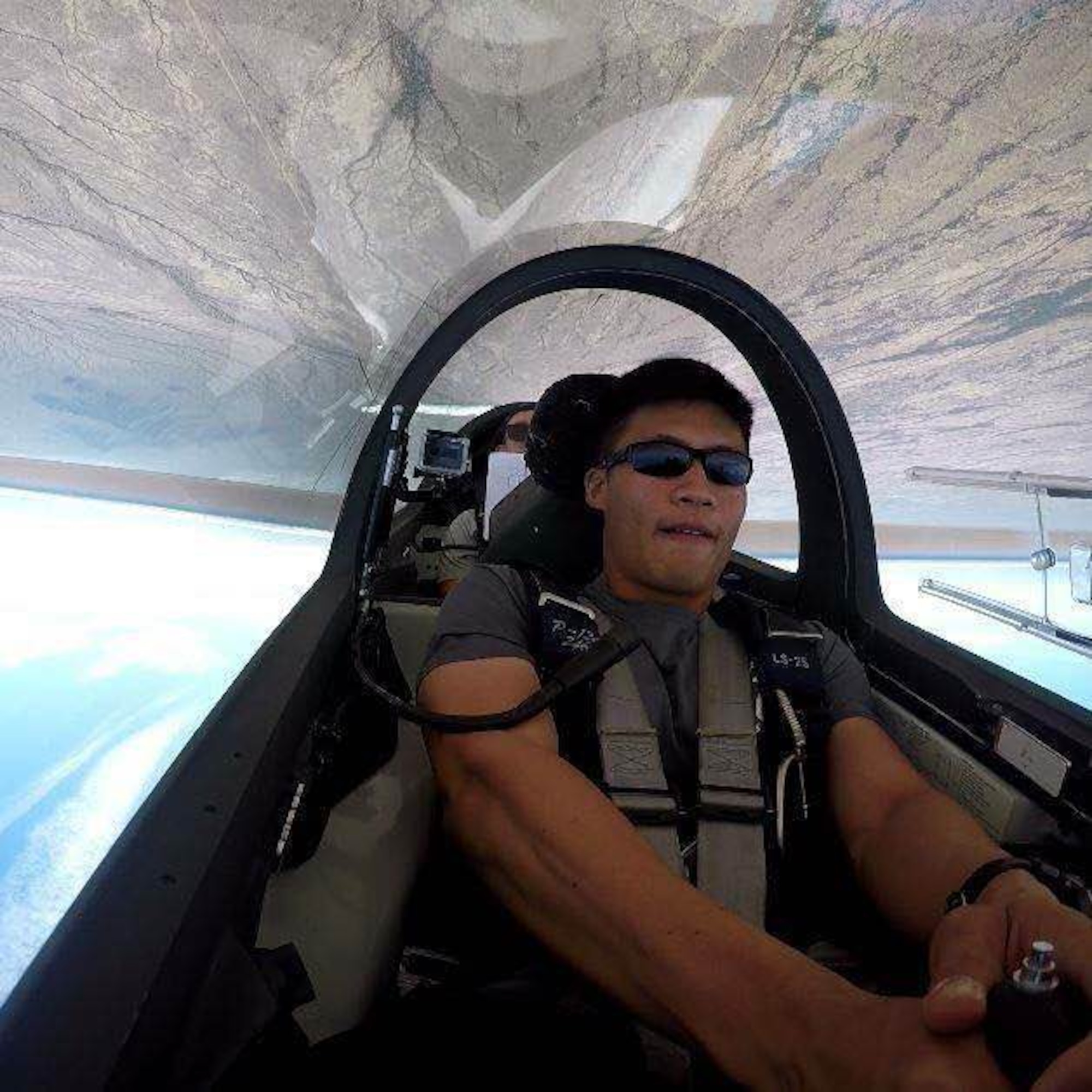 Cadet 2nd Class Khornwitpong Soonthonnitikul, an international student from Thailand at the U.S. Air Force Academy, flies upside down in a TG-16A glider during aerobatics training over Coolidge, Arizona. (Courtesy photo)
