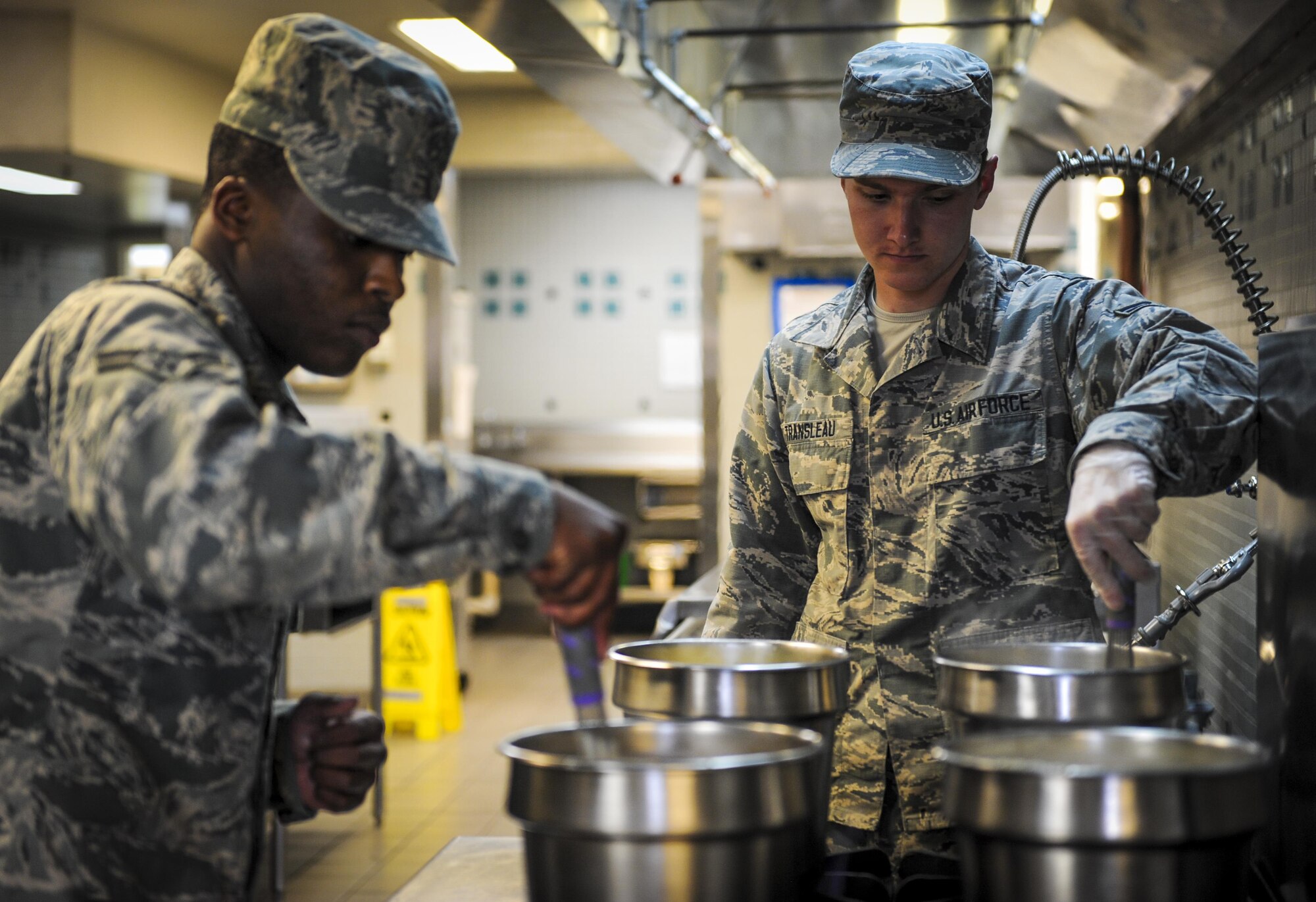 Airman 1st Class Joseph Transleau, a food service apprentice with the 1st Special Operations Force Support Squadron, stirs soup at The Reef, Hurlburt Field, Fla., March 28, 2016. The Reef dining facility prepares food for 400-500 Air Commandos every day. (U.S. Air Force photo by Senior Airman Meagan Schutter)