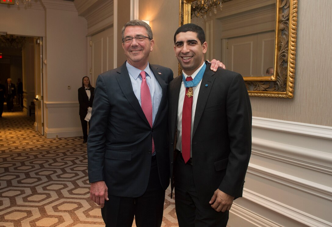 Defense Secretary Ash Carter stands for a photo with Medal of Honor recipient Army Capt. Florent Groberg at the World Affairs Council's 2016 Global Education Gala in Washington, D.C., March 29, 2016. DoD photo by Navy Petty Officer 1st Class Tim D. Godbee