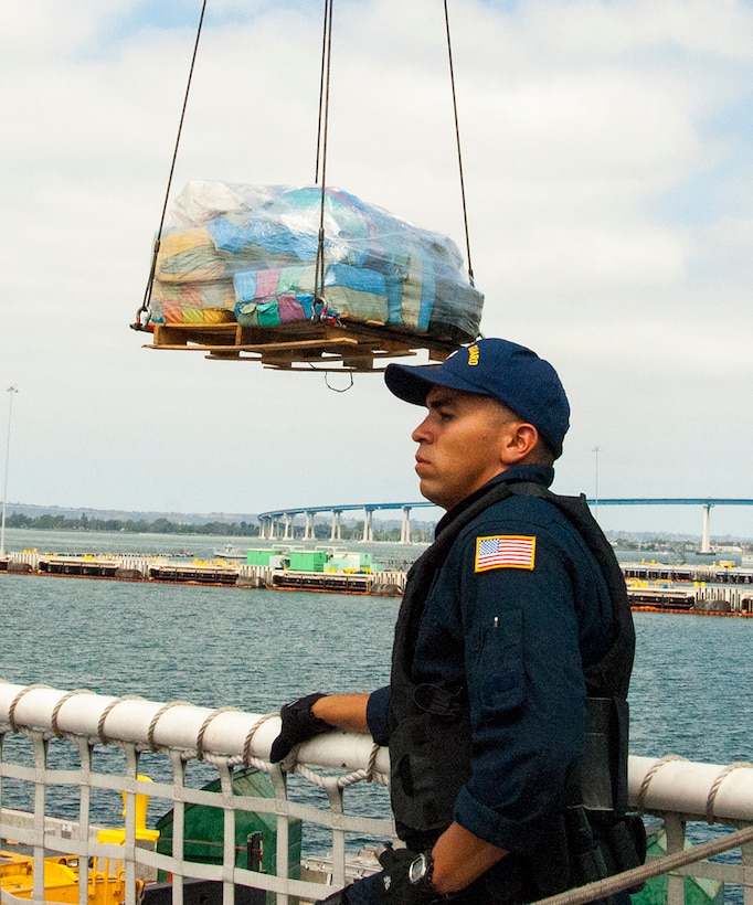 Coast Guard cutter Stratton crew members offload 34 metric tons of cocaine in San Diego, Aug. 10, 2015. The drugs were seized in 23 separate interdictions by Coast Guard cutters and Coast Guard law enforcement teams operating in known drug transiting zones. Coast Guard photo by Petty Officer Third Class Andrea Anderson
