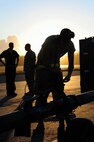 U.S. Air Force Senior Airman Brandon Wirth, a crew chief with the 393rd Aircraft Maintenance Unit, prepares to tow a U.S. Air Force B-2 Spirit bomber, March 11, 2016, in the U.S. Pacific Command area of operations. The Department of Defense regularly conducts bomber training missions with and in support of the geographic combatant commands to provide an always-ready global strike capability. (U.S. Air Force photo by Senior Airman Joel Pfiester/Released)