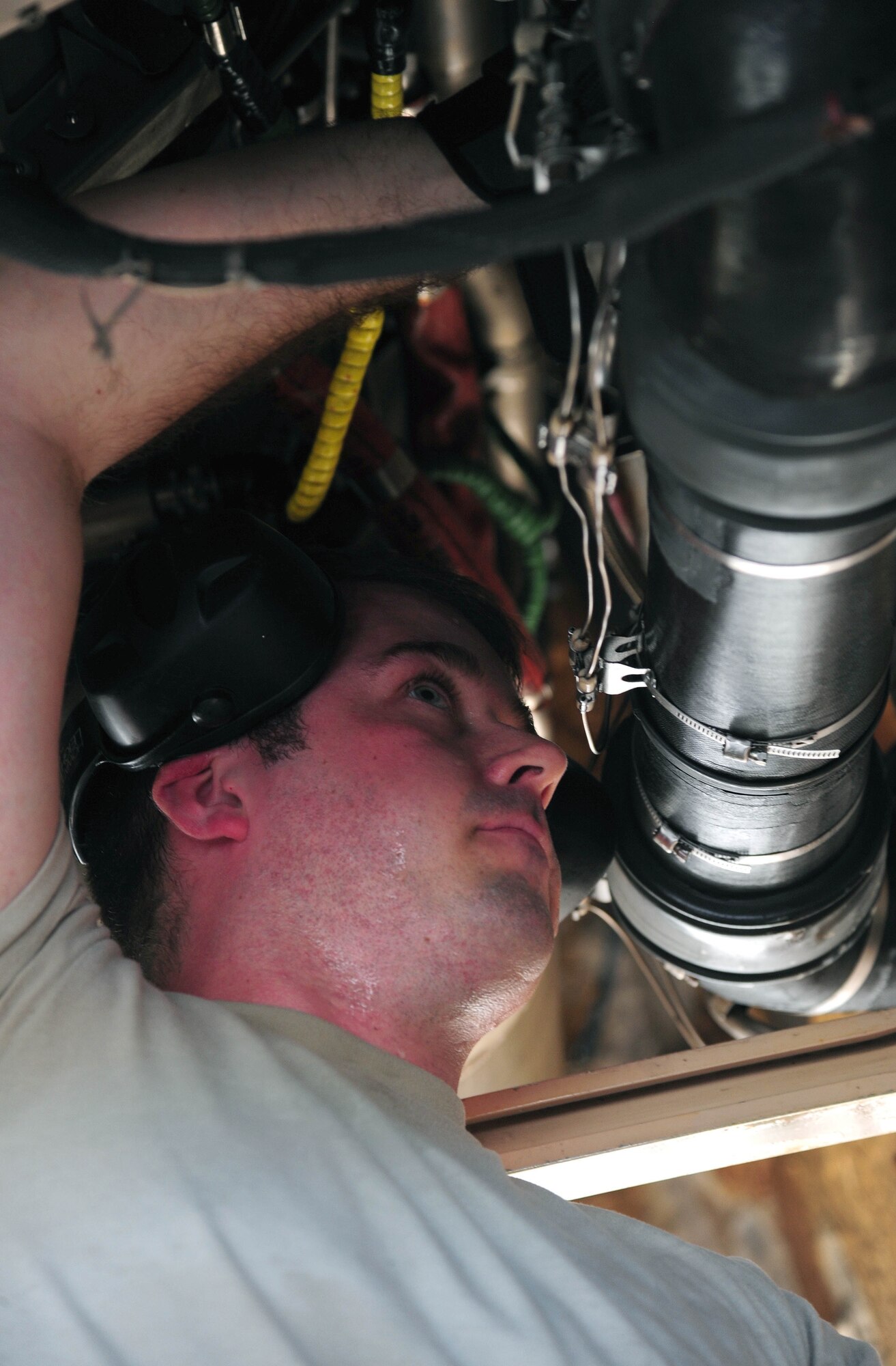 U.S. Air Force Staff Sgt. James Torrance, an electrical and environmental systems technician with the 131st Aircraft Maintenance Squadron, performs maintenance on a U.S. Air Force B-2 Spirit bomber, March 11, 2016, in the U.S. Pacific Command area of operations.  These deployments help maintain global stability and security while enabling aircrew to become familiar with operating in different regions. (U.S. Air Force photo by Senior Airman Joel Pfiester/Released)