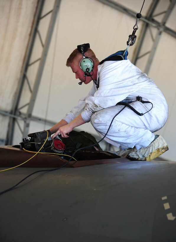 U.S. Air Force Staff Sgt. Dillon Cody, an aircraft fuel systems technician with the 509th Maintenance Squadron, performs an aerial-refueling operational check on a U.S. Air Force B-2 Spirit bomber, March 13, 2016, in the U.S. Pacific Command area of operations. Bomber training missions and deployments ensure crews maintain a heightened state of readiness to demonstrate their ability to provide an always-ready global strike capability. (U.S. Air Force photo by Senior Airman Joel Pfiester/Released)