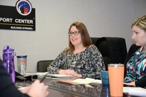Carol Elder, Interior Design Section team lead for the U.S. Army Engineering and Support Center, Huntsville, meets with Interior Designer Lauren Ploetze and other members of the Huntsville Center Medical Interior Design team. Elder played a key role in standing up the interior design mission, an effort that began in 2010.
