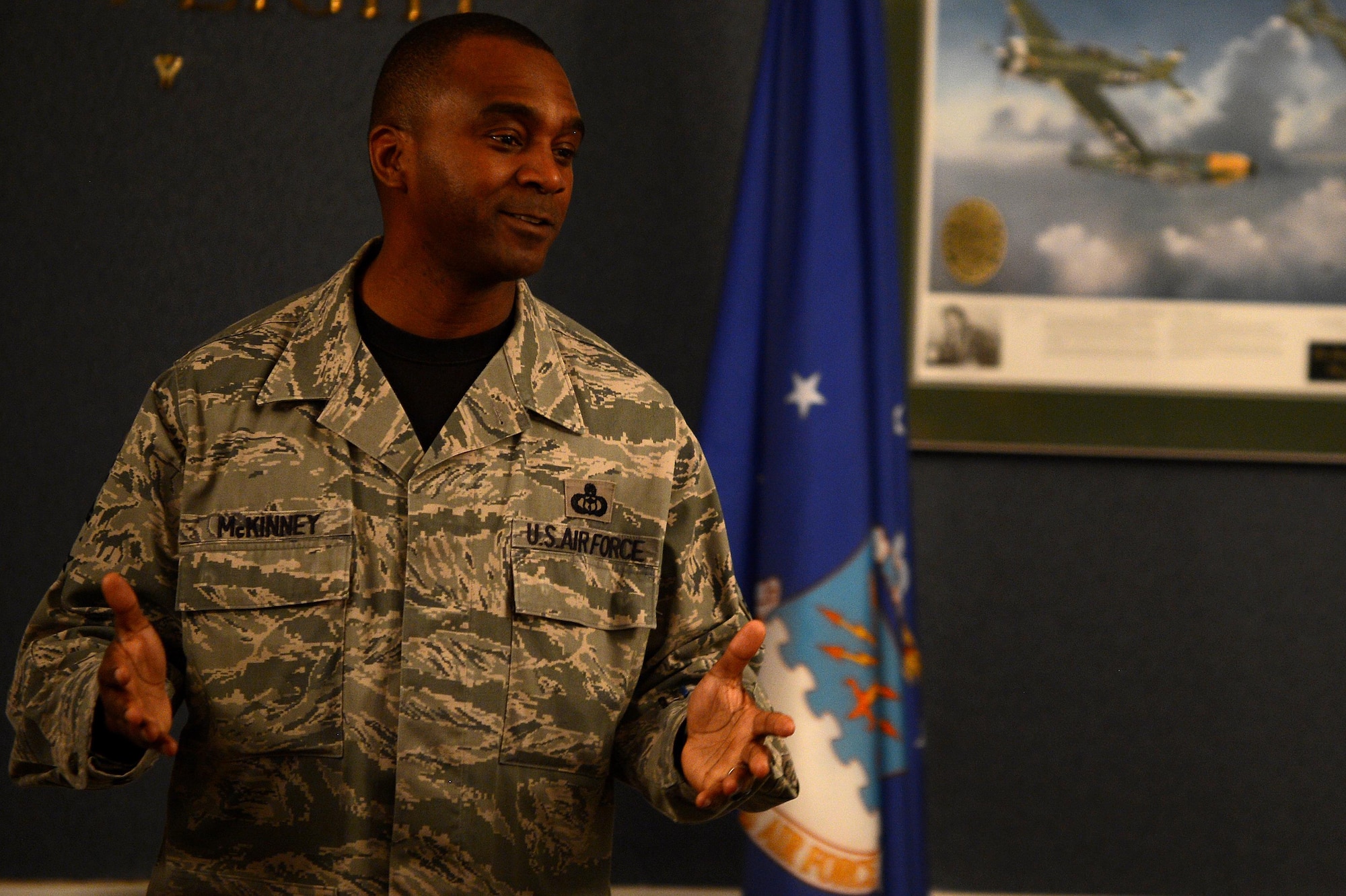 U.S. Air Force Chief Master Sgt. Christopher McKinney, 20th Fighter Wing command chief, speaks to attendees of the Air Force Assistance Fund kickoff commander’s breakfast at Shaw Air Force Base, S.C., March 25, 2016. McKinney spoke about his experience receiving financial assistance to attend two family member’s funerals early in his career and how fellow Airmen’s generosity motivated him. (U.S. Air Force photo by Senior Airman Jonathan Bass)