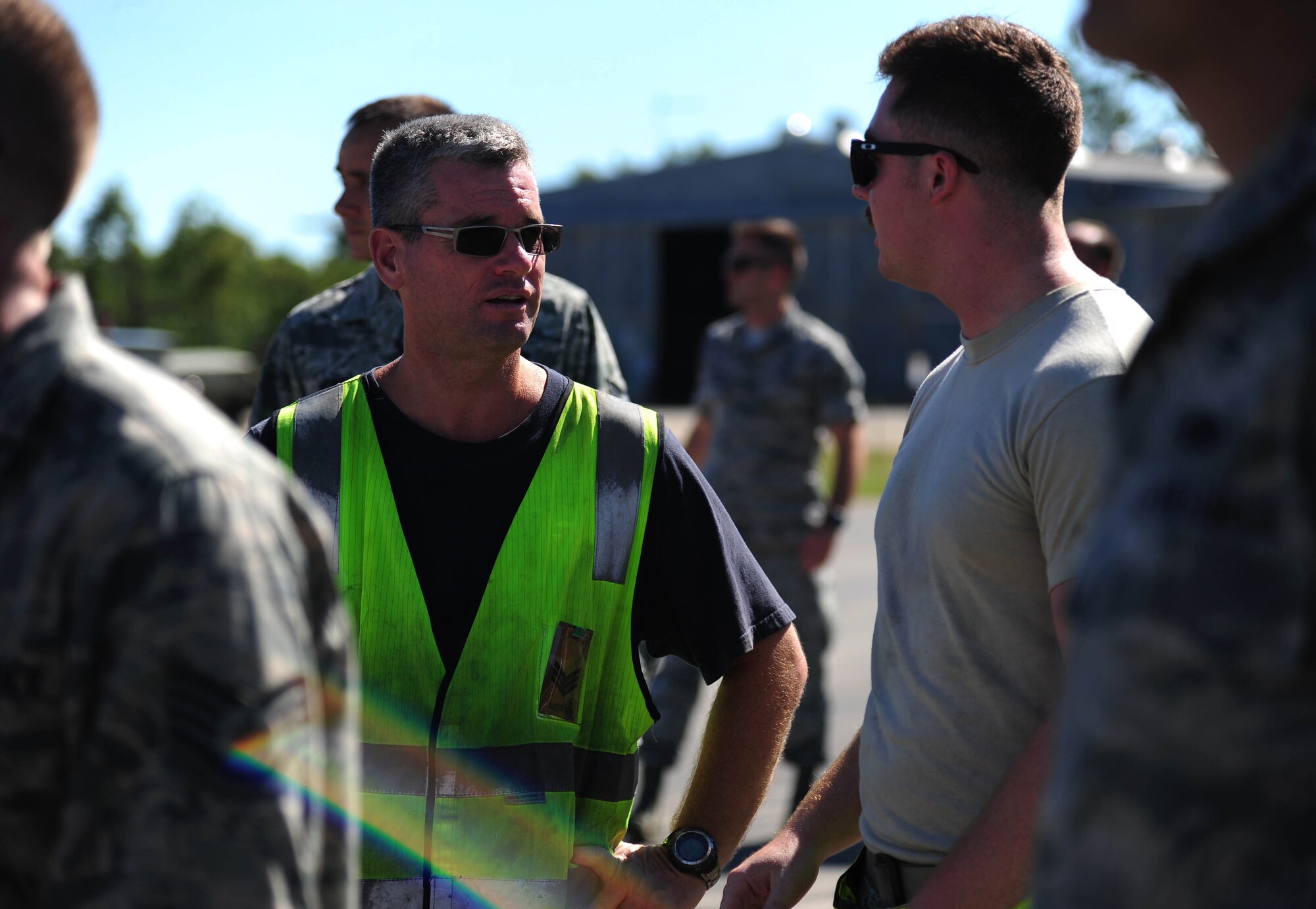 U.S. Air Force Airmen from Whiteman Air Force Base, Missouri, and the Royal Australian Air Force perform a foreign object and debris walk at RAAF Base Tindal, Australia, March 22, 2016. The FOD walk was conducted during a training mission where a B-2 Spirit conducted an engine running crew change at the base. The B-2 was one of three that were deployed to the Indo-Asia-Pacific region from March 8 through 29 to enhance bomber crew readiness and proficiency and to integrate capabilities with key regional partners. U.S. Strategic Command bombers regularly rotate through the Indo-Asia-Pacific region to conduct theater security cooperation engagements with U.S. allies and partners and demonstrate a shared commitment to promoting security and stability in the region. (U.S. Air Force photo by Senior Airman Joel Pfiester/Released)