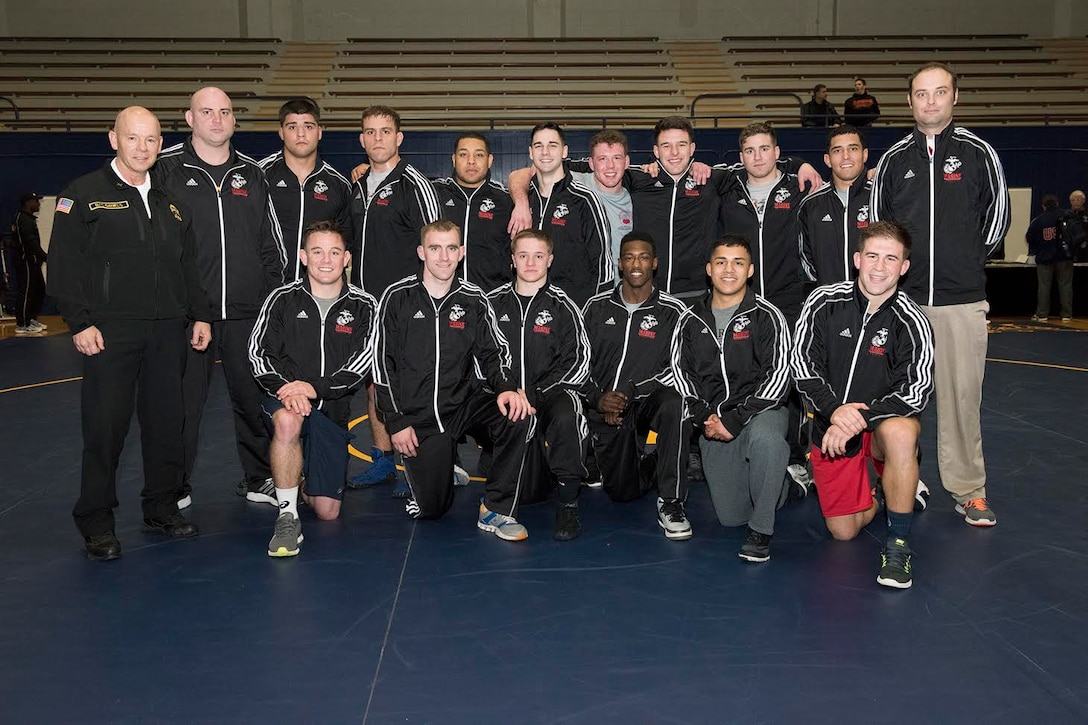 MARINE CORPS BASE CAMP LEJEUNE, N.C. — Marines with the All-Marine Wrestling Team pose during the Armed Forces Championships 2016 at Naval Base Kitsap Feb. 20-21. The AMWT placed second in both the Freestyle and Greco-Roman categories and four Marines qualified for the upcoming U.S. Olympic Trials.