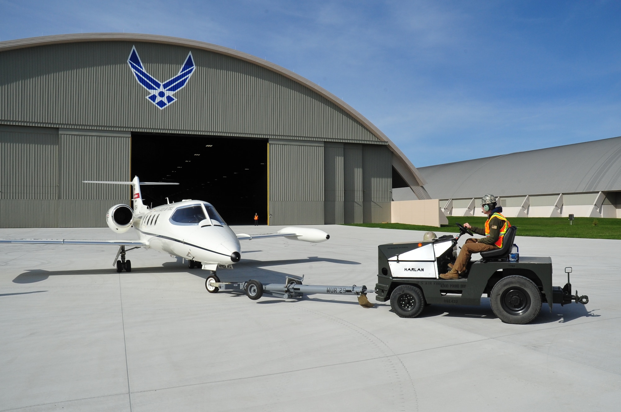 DAYTON, Ohio -- Museum Restoration crews move the Learjet C-21A aircraft into the new fourth building at the National Museum of the U.S. Air Force on March 30, 2016. (U.S. Air Force photo by Ken LaRock)