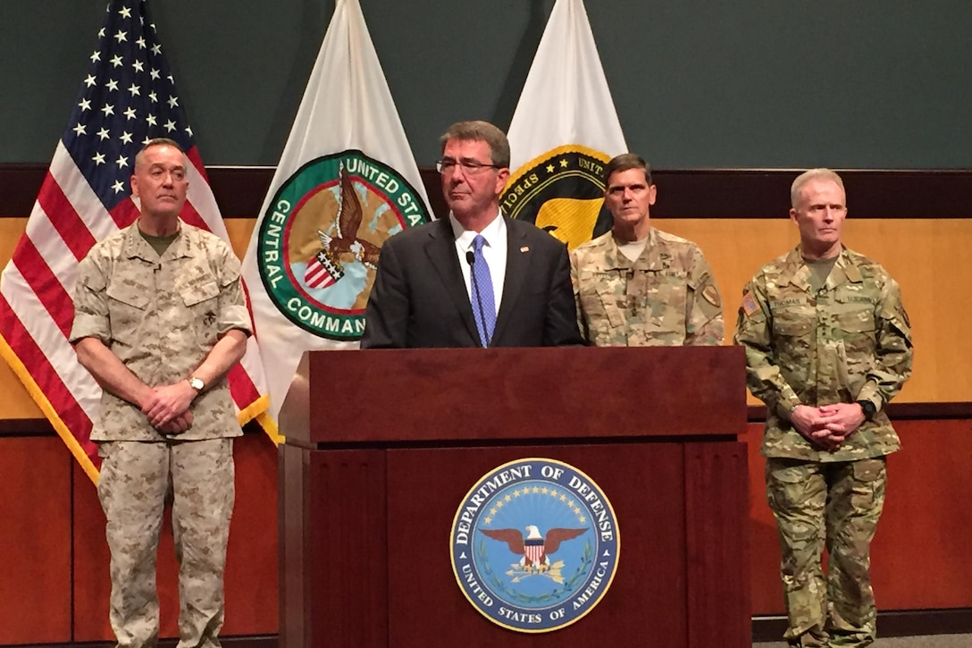 Defense Secretary Ash Carter, at lectern, speaks during a press briefing with, from left, Marine Corps Gen. Joe Dunford; chairman of the Joint Chiefs of Staff; Army Gen. Joseph Votel, commander of U.S. Central Command; and Army Gen. Raymond Thomas, commander of U.S. Special Operations Command, at MacDill Air Force Base, Fla., March 30, 2016. Votel and Thomas assumed leadership of their respective commands during ceremonies earlier in the day. DoD photo