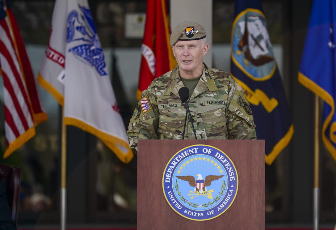 Army Gen. Raymond A. "Tony" Thomas delivers remarks after assuming command of U.S. Special Operations Command at MacDill Air Force Base, Fla., March 30, 2016. Army Gen. Joseph L. Votel, the outgoing commander, assumed leadership of U.S. Central Command in a separate ceremony. Air Force photo by Tech. Sgt. Angelita M. Lawrence