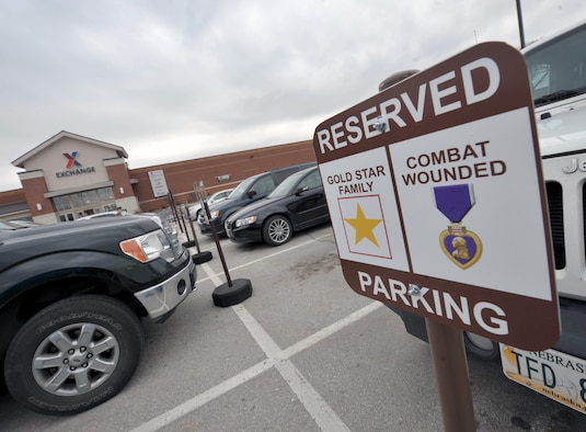 New signs have been posted to reserve parking for Combat Wounded Veterans and Gold Star Families. The reserved-parking signs were put up at the Commissary, Exchange, Offutt Field House and the Patriot Club. (U.S. Air Force photo by Zachary Hada)