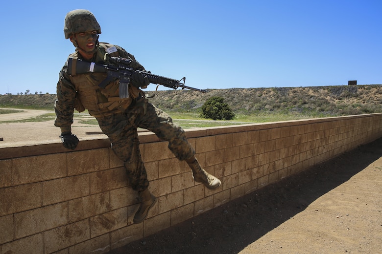 Private Michael L. Riddle, Delta Company, 1st Recruit Training Battalion, jumps over a wall during a Crucible event at Marine Corps Base Camp Pendleton, March 23. Riddle is graduating as a squad leader and plans on staying in the Marine Corps for as long as possible. Following graduation, he will continue his training at the School of Infantry at MCB CPEN, to learn his primary job as an infantryman.  Riddle intends to finish his degree and eventually become a counter terrorist agent. Annually, more than 17,000 males recruited from the Western Recruiting Region are trained at MCRD San Diego. Delta Company is scheduled to graduate April 1.