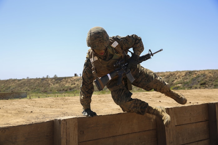 Private Michael L. Riddle, Delta Company, 1st Recruit Training Battalion, jumps over a wall during a Crucible event at Marine Corps Base Camp Pendleton, March 23. Riddle is graduating as a squad leader and plans on staying in the Marine Corps for as long as possible. Following graduation, he will continue his training at the School of Infantry at MCB CPEN, to learn his primary job as an infantryman.  Riddle intends to finish his degree and eventually become a counter terrorist agent. Annually, more than 17,000 males recruited from the Western Recruiting Region are trained at MCRD San Diego. Delta Company is scheduled to graduate April 1.
