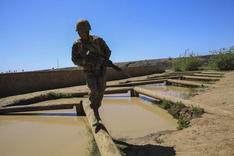 Private Michael L. Riddle, Delta Company, 1st Recruit Training Battalion, runs across an obstacle during a Crucible event at Marine Corps Base Camp Pendleton, March 23. Riddle is graduating as a squad leader and plans on staying in the Marine Corps for as long as possible. Following graduation, he will continue his training at the School of Infantry at MCB CPEN, to learn his primary job as an infantryman.  Riddle intends to finish his degree and eventually become a counter terrorist agent. Annually, more than 17,000 males recruited from the Western Recruiting Region are trained at MCRD San Diego. Delta Company is scheduled to graduate April 1.