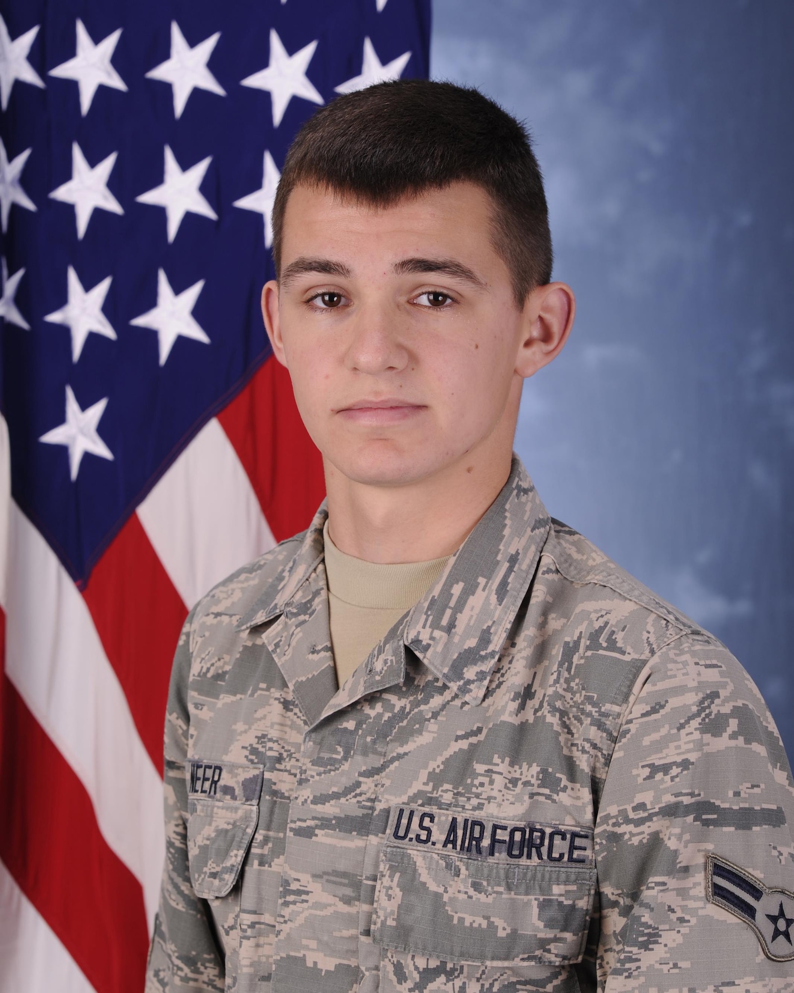 Airman 1st Class Nathan Neer, 325th Maintenance Squadron conventional maintenance crew member poses for a photo March 29, 2016, at the Tyndall photo lab. Neer was selected by his leadership as the 325th MXS unsung hero. (U.S. Air Force photo by Senior Airman Solomon Cook/Released) 