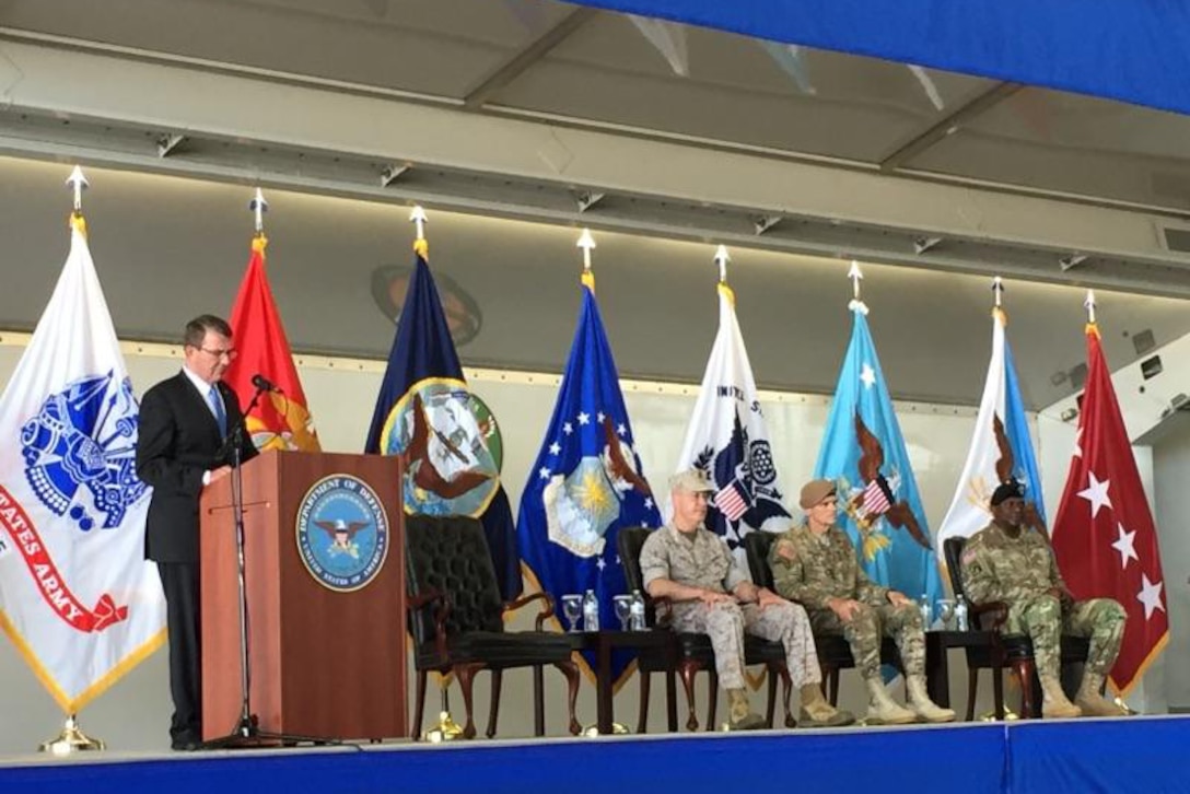 Defense Secretary Ash Carter delivers remarks during a change-of-command ceremony for U.S. Central Command at MacDill Air Force Base, Fla., March 30, 2016. Joining Carter on stage are, from left, Marine Corps Gen. Joe Dunford, chairman of the Joint Chiefs of Staff; Army Gen. Joseph Votel, incoming commander of Centcom; and outgoing commander Gen. Lloyd J. Austin III. DoD photo