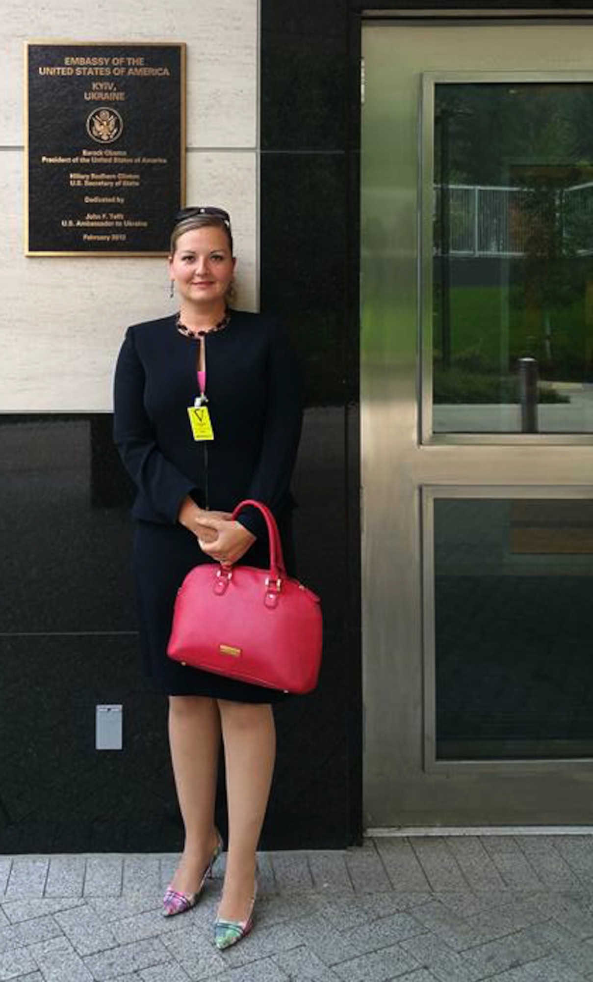 Staff Sgt. Anastasia Stuart, assigned to the 6th Medical Support Squadron, stands in front of the U.S. Embassy in Kyiv, Ukraine. Stuart was selected through the Language Enabled Airman Program to translate and interpret for the Office of Defense Cooperation in a number of crucial real-world areas related to subcommittee implementation plans. (Courtesy photo) 