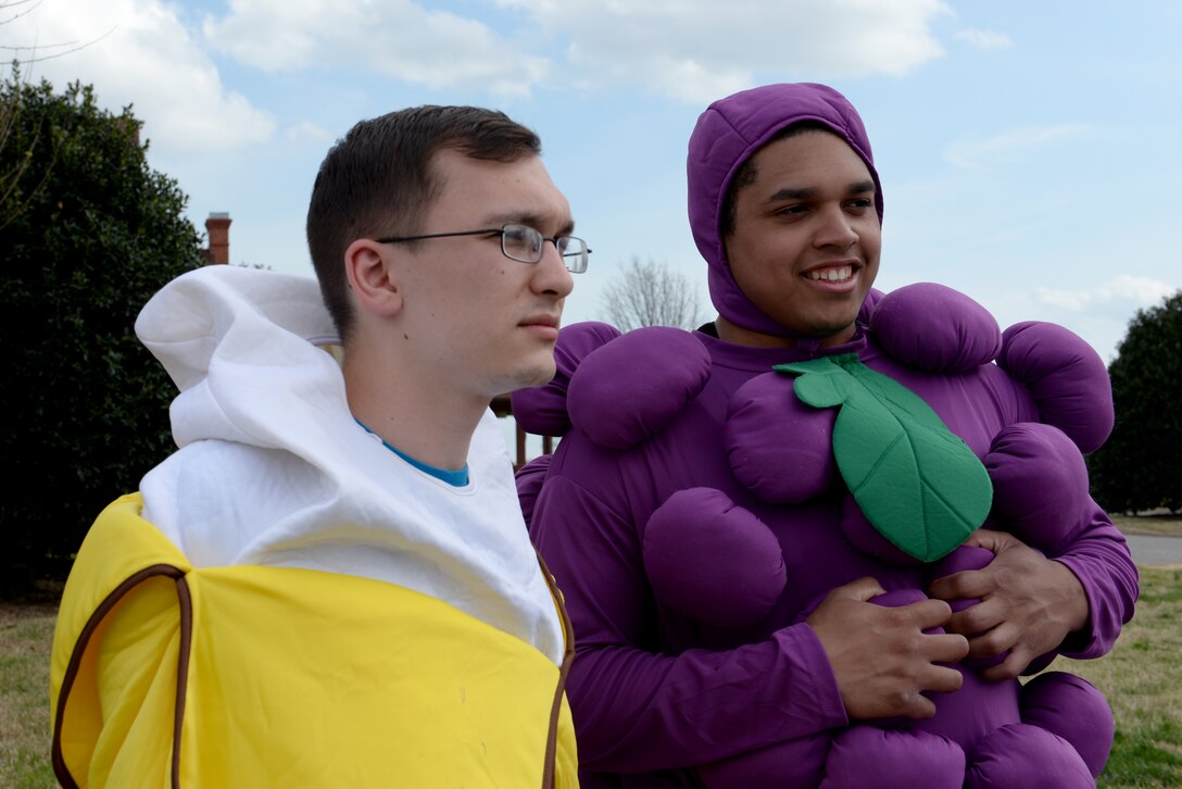 U.S. Air Force Senior Airman Tyler Cutlip, 633rd Medical Support Squadron dietary technician, left, and Airman Alex McClendon, 633rd Aerospace Medicine Squadron bioenvironmental engineer technician, wait for runners during the National Nutrition Month 5K at Langley Air Force Base, Va., March 25, 2016. Each March, the Academy Nutrition and Dietetics uses the awareness month to highlight information on how to make informed food choices and lead a healthy lifestyle. (U.S. Air Force photo by Airman 1st Class Kaylee Dubois/Released)