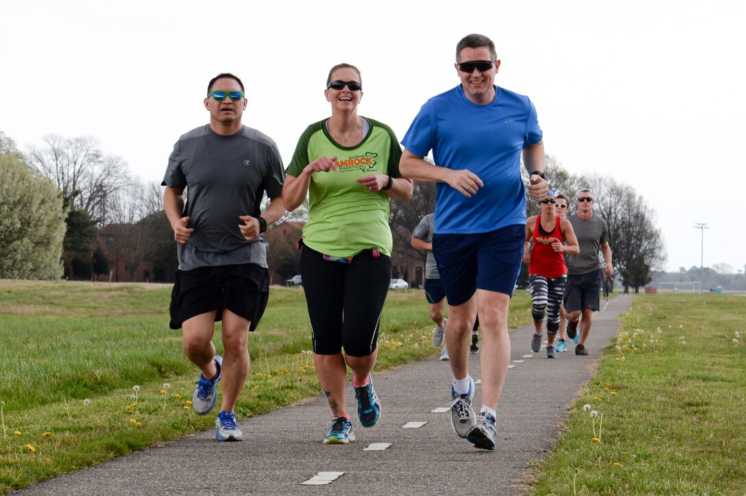 Participants run during the National Nutrition Month 5K at Langley Air Force Base, Va., March 25, 2016. The annual awareness campaign seeks to enhance nutrition education and focuses attention on the importance of developing sound eating and physical activity habits. (U.S. Air Force photo by Airman 1st Class Kaylee Dubois)