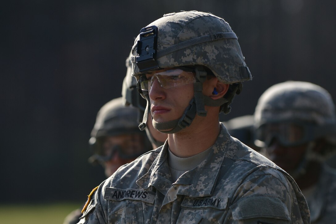 U.S. Army Spc. Kyle Andrews, a transportation management coordinator with the 149th Seaport Operations Company, 7th Transportation Brigade Expeditionary, watches as a CH-47 Chinook lands at Fort Eustis, Va., March 24, 2016. The 7th Trans. Bde. (Ex.) supplied a high-mobility multipurpose wheeled vehicle for the training event. (U.S. Air Force photo by Staff Sgt. Natasha Stannard)