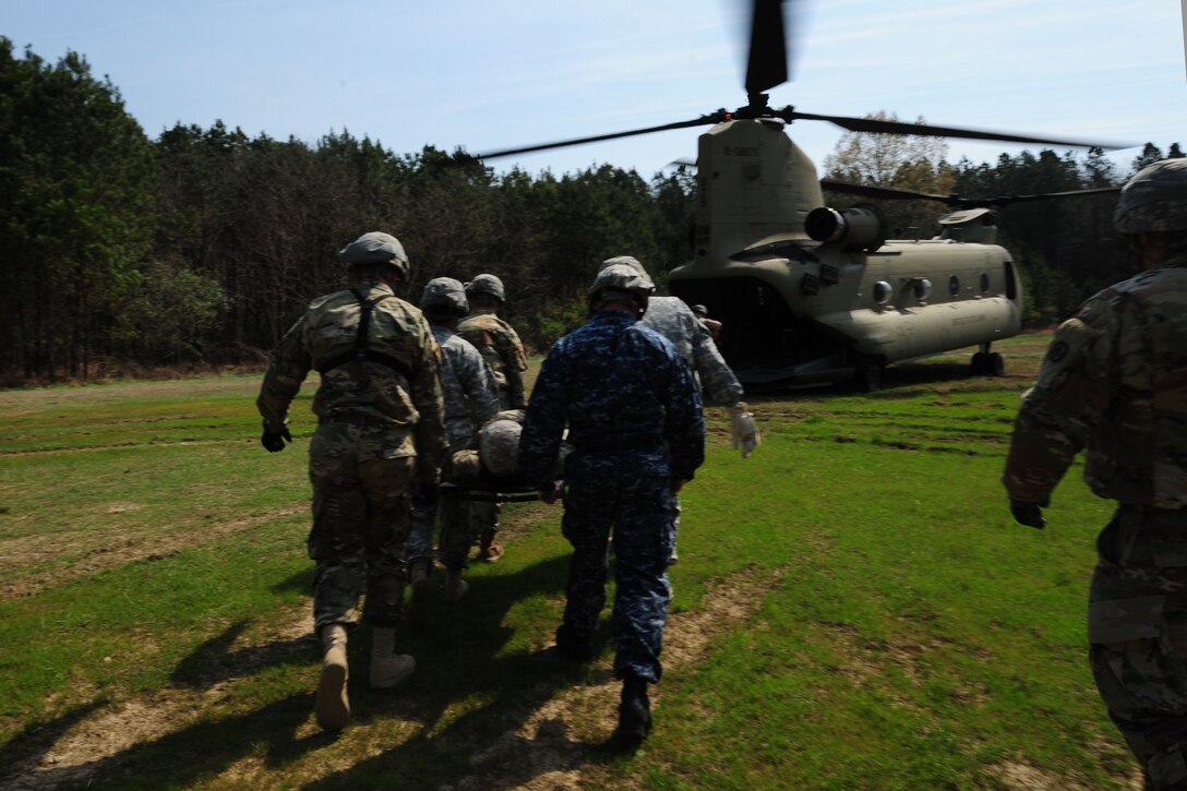 U.S. Soldiers assigned to the 689th Rapid Port Opening Element practice casualty evacuations at Fort Eustis, Va., March 24, 2016. The RPOE is a part of the nation’s global response force as they provide rapid transport for equipment, people and humanitarian cargo. (U.S. Air Force photo by Staff Sgt. Natasha Stannard)