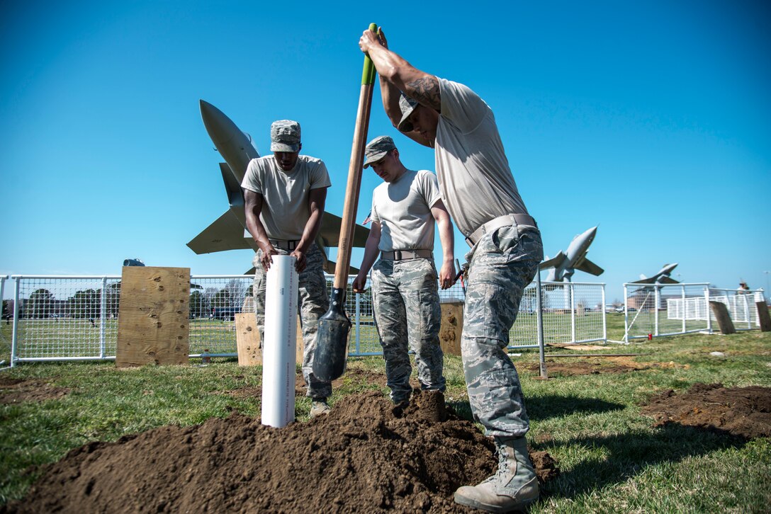 U.S. Air Force Staff Sgt. Johnny Acevedo, a heavy equipment operator assigned to the 633rd Civil Engineer Squadron, demonstrates how to properly use a post hole digger at Langley Air Force Base, Va., March 16, 2016. Heavy equipment operators go through 14-weeks of training at Fort Leonard Wood, Mo. (U.S. Air Force photo by Staff Sgt. J.D. Strong II)