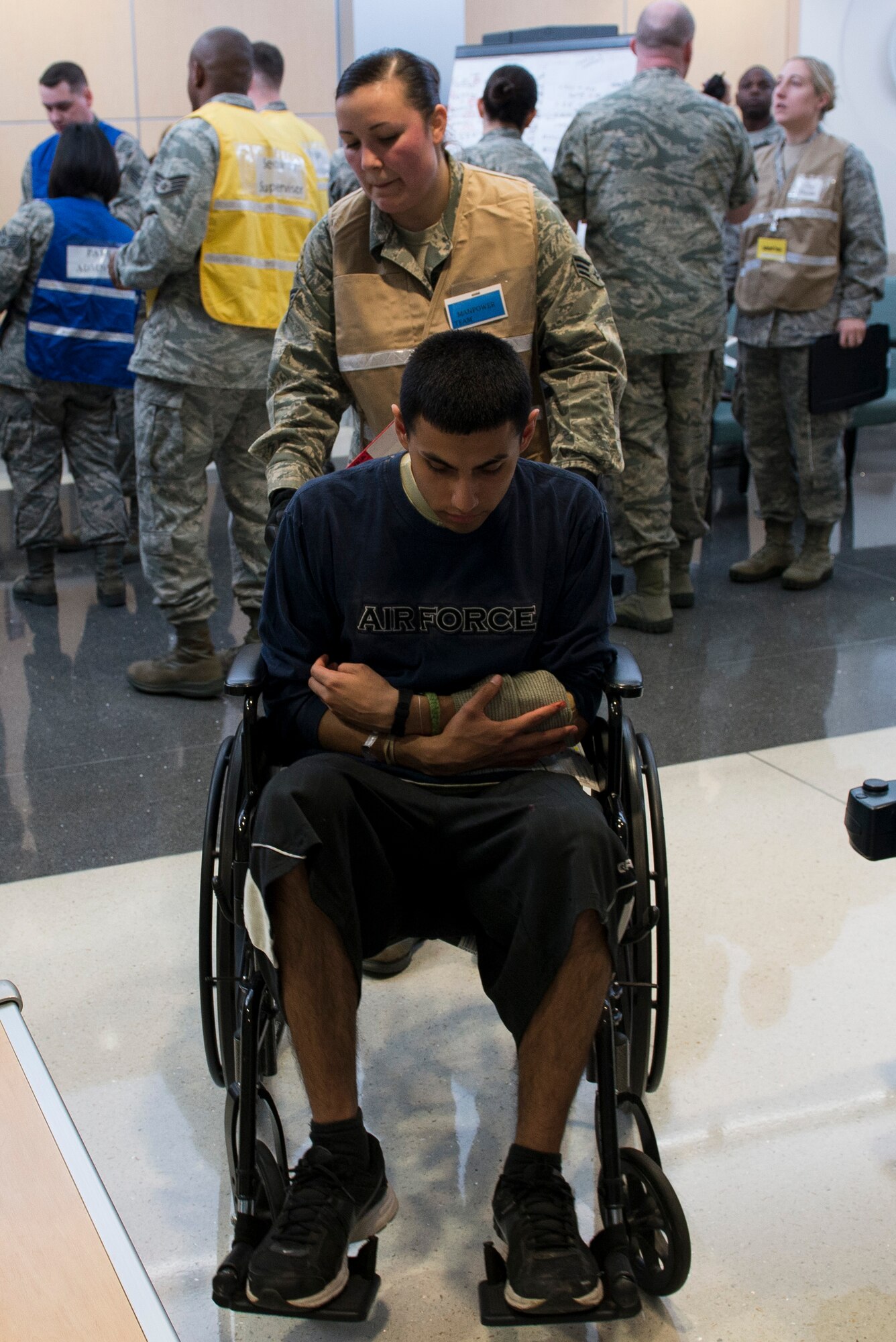 A simulated patient is transported to a clinic for further testing for an injury sustained during a mass casualty exercise at Langley Air Force Base, Va., March 24, 2016. The patient sustained a simulated open left forearm fracture with a foreign object sticking out and required pain medicine, an X-ray and surgery. (U.S. Air Force photo by Airman 1st Class Derek Seifert)