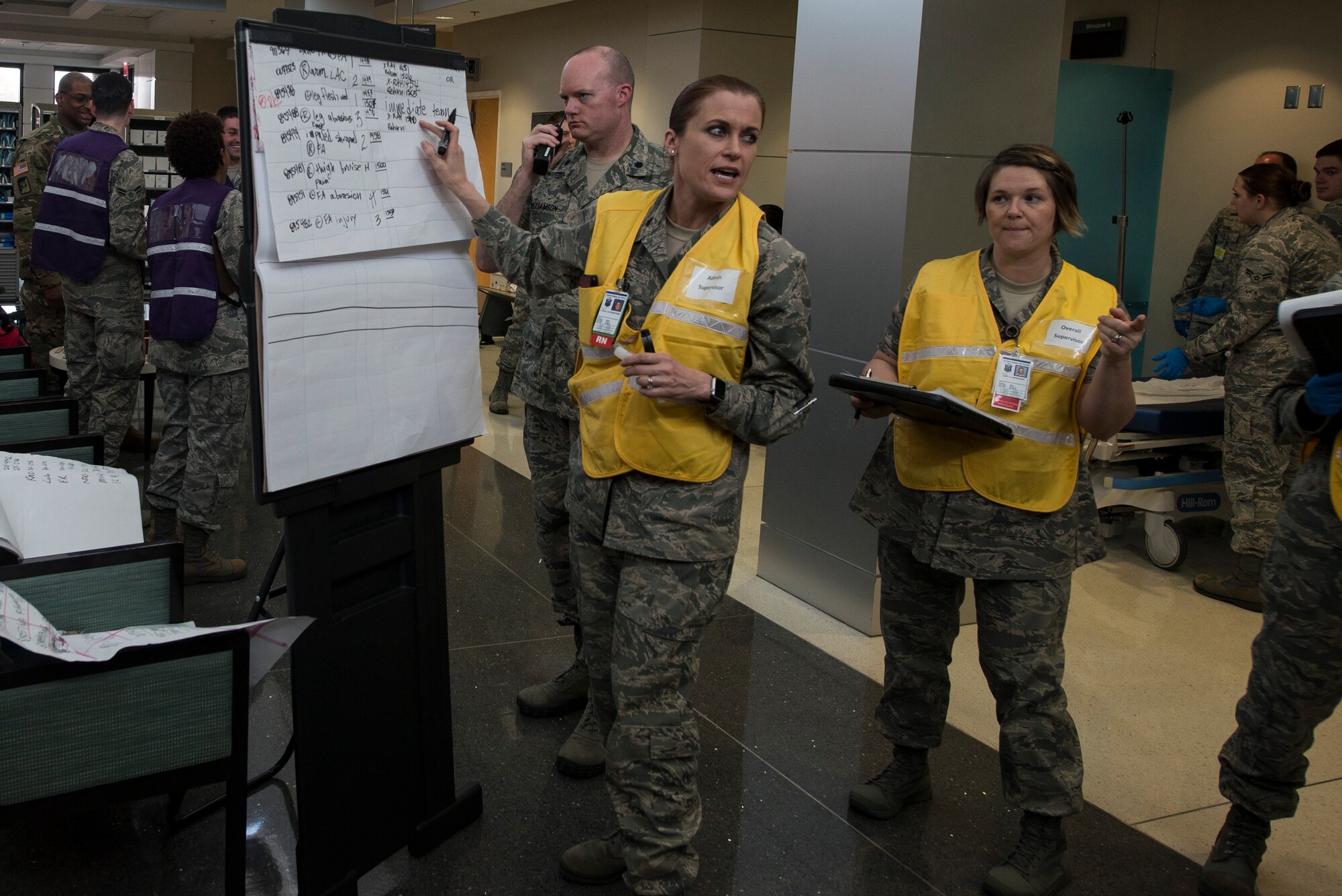 U.S. Airmen assigned to the 633rd Medical Group receive information about patients during a mass casualty exercise at Langley Air Force Base, Va., March 24, 2016. The medical staff created a patient tracking system to ensure patients were accounted for at all times. (U.S. Air Force photo by Airman 1st Class Derek Seifert)