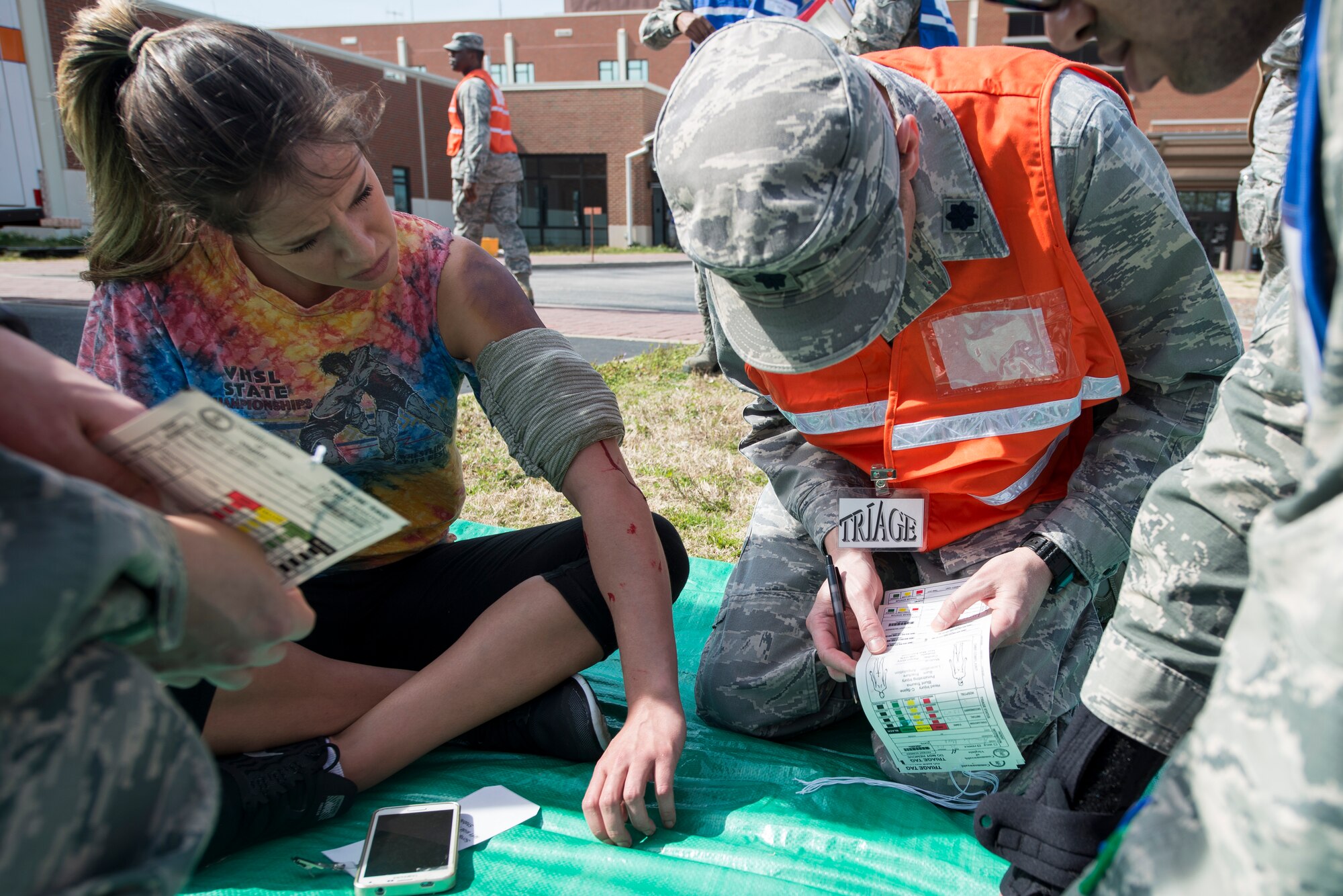 U.S. Airmen assigned to the 633rd Medical Group evaluate a patient’s pain level during a mass casualty exercise at Langley Air Force Base, Va., March 24, 2016. Approximately 600 medical personnel participated in the exercise and provided care for 30 patients in the simulated event. (U.S. Air Force photo by Airman 1st Class Derek Seifert)