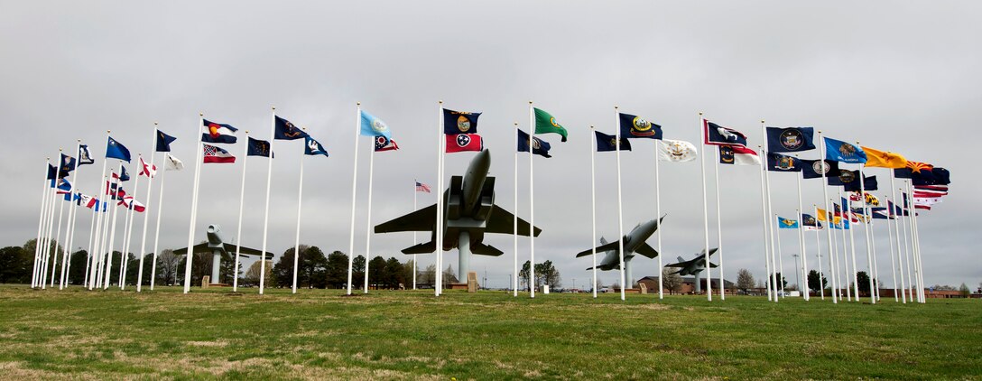 The 50 U.S. state flags, six U.S. territories’, Air Force and Army flags wave at Memorial Park at Langley Air Force Base, Va., March 28, 2016. Along with the flags, F-86 Sabre, F-105 Thunderchief, F-15A Eagle and F-16 Fighting Falcon replicas memorialize Service members who gave their lives in past conflicts, such as the Korean, Vietnam and Cold Wars. (U.S. Air Force photo by Airman 1st Class Derek Seifert)