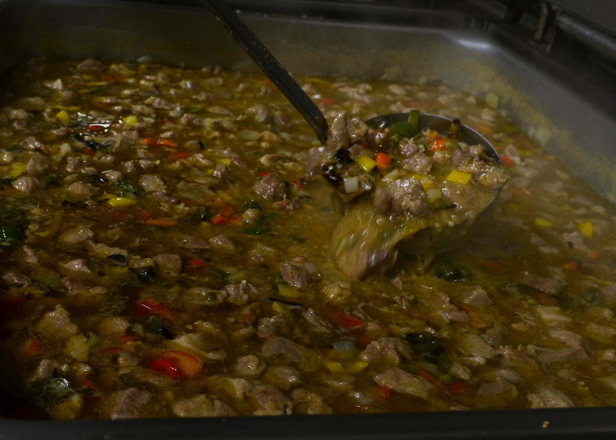 A vat of chili bubbles, ready to be served for a Mexican-themed lunch, March 25, 2016, at Aviano Air Base, Italy. Chefs Sikey, Stretch and Gorilla Rich, three “Messlords” members, prepared the food for the Wyvern community. (U.S. Air Force photo by Senior Airman Austin Harvill/Released)