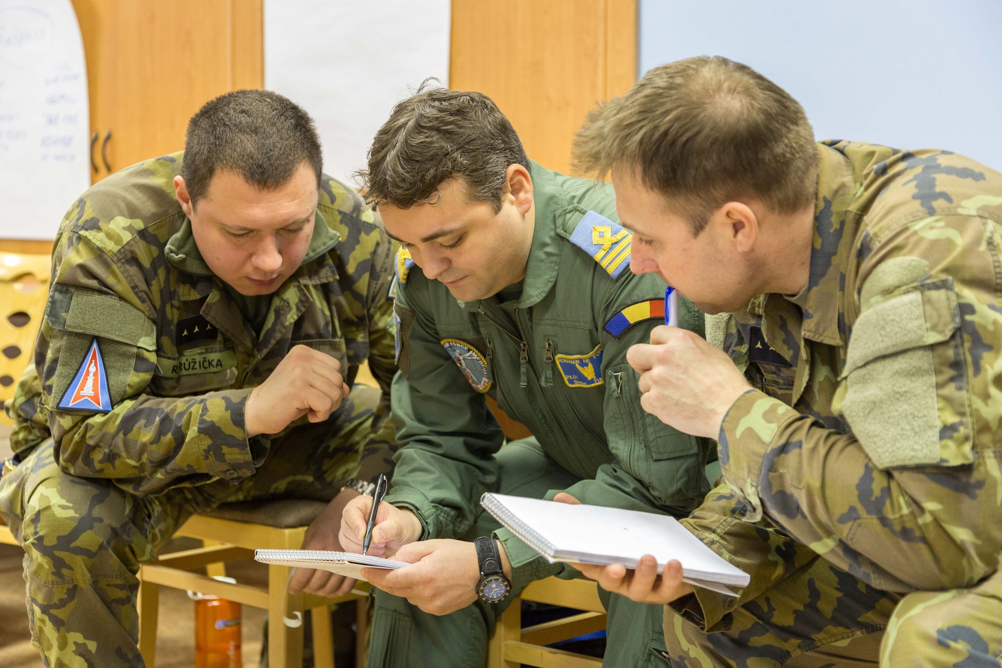 Inter-European Air Forces Academy officer and NCO students prepare and collaborate during a critical thinking exercise during a combined international officer and NCO mobile professional military education course in Brno, Czech Republic. Twenty-one students from Czech Republic, Hungary, Lithuania and Romania participated in the course. This was the IEAFA’s second two-week course. IEAFA’s first five-week in-residence course begins April 25, 2016 at Kapaun Air Station, Germany. (U.S. Air Force photo/Senior Master Sgt. Travis Robbins)
