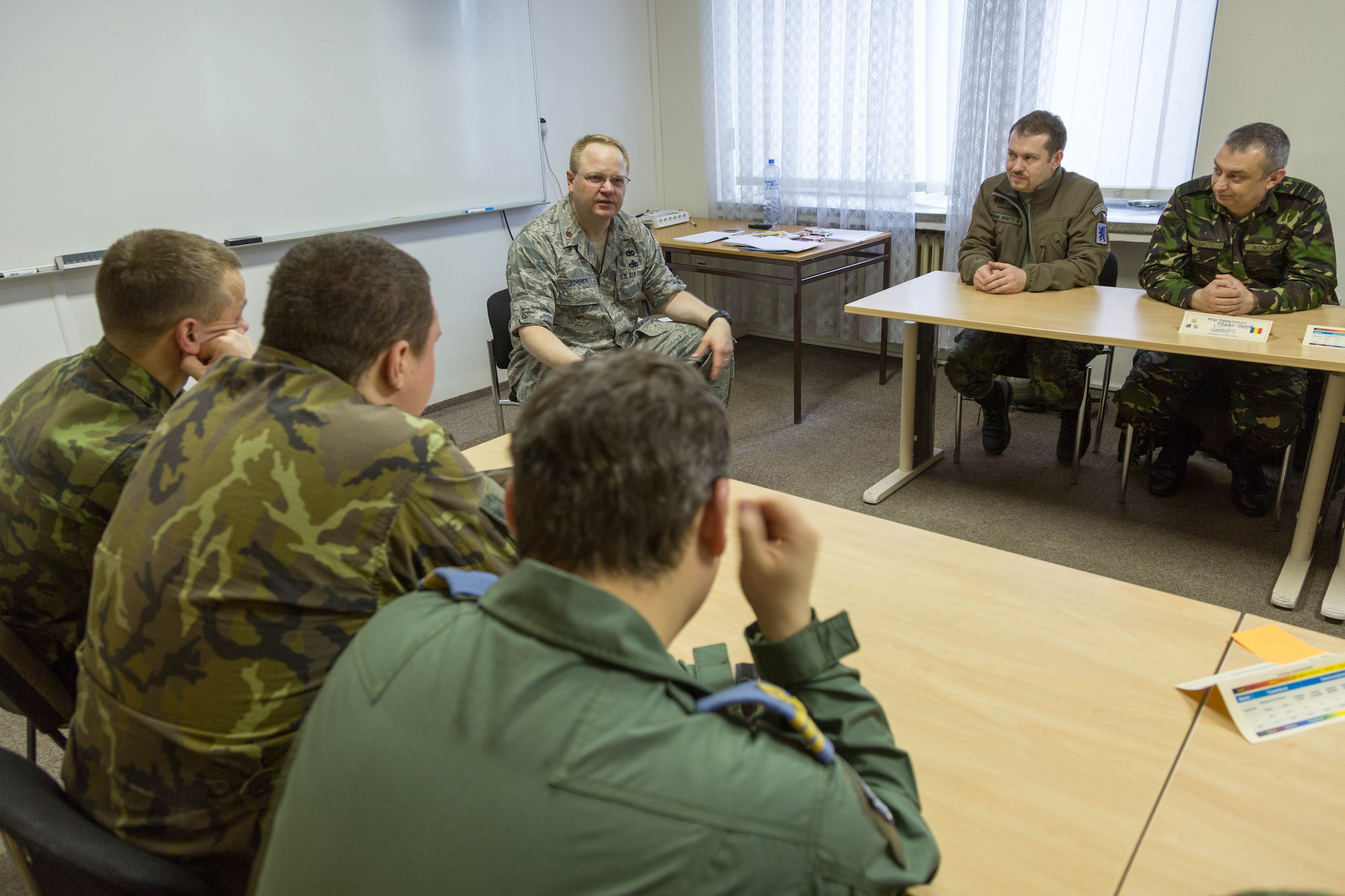 U.S. Air Force Maj. Joel Scherer, a Squadron Officer School instructor from Maxwell Air Force Base, Alabamba, debriefs officer and NCO students after an exercise during a combined international officer and NCO mobile professional military education course in Brno, Czech Republic. Twenty-one students from Czech Republic, Hungary, Lithuania and Romania participated in the course. This was the Inter-European Air Forces Academy’s second two-week course. IEAFA’s first five-week in-residence course begins April 25, 2016 at Kapaun Air Station, Germany. (U.S. Air Force photo/Senior Master Sgt. Travis Robbins)