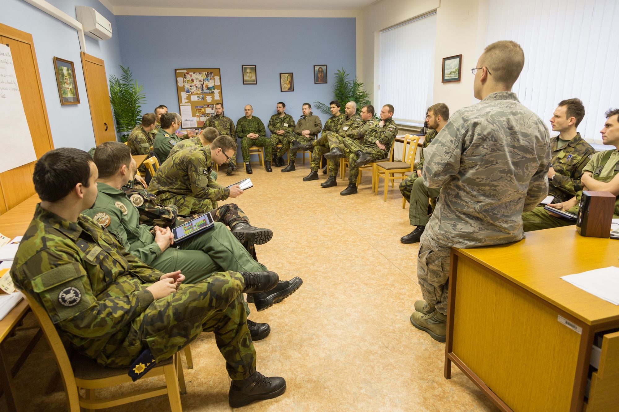 U.S. Air Force Capt. Truett Kinard, a Squadron Officer School instructor from Maxwell Air Force Base, Germany, talks to a class of officers and NCOs during a combined international officer and NCO mobile professional military education course in Brno, Czech Republic. Twenty-one students from Czech Republic, Hungary, Lithuania and Romania participated in the course. This was the Inter-European Air Forces Academy’s second two-week course. IEAFA’s first five-week in-residence course begins April 25, 2016 at Kapaun Air Station, Germany. (U.S. Air Force photo/Senior Master Sgt. Travis Robbins)