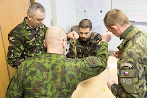Inter-European Air Forces Academy students collaborate during a team building exercise during a combined mobile professional military education course for international officers and NCOs in Brno, Czech Republic. Twenty-one students from Czech Republic, Hungary, Lithuania and Romania participated in the course. IEAFA’s first five-week in-residence course begins April 25, 2016, at Kapaun Air Station, Germany. (U.S. Air Force photo/Senior Master Sgt. Travis Robbins/Released)