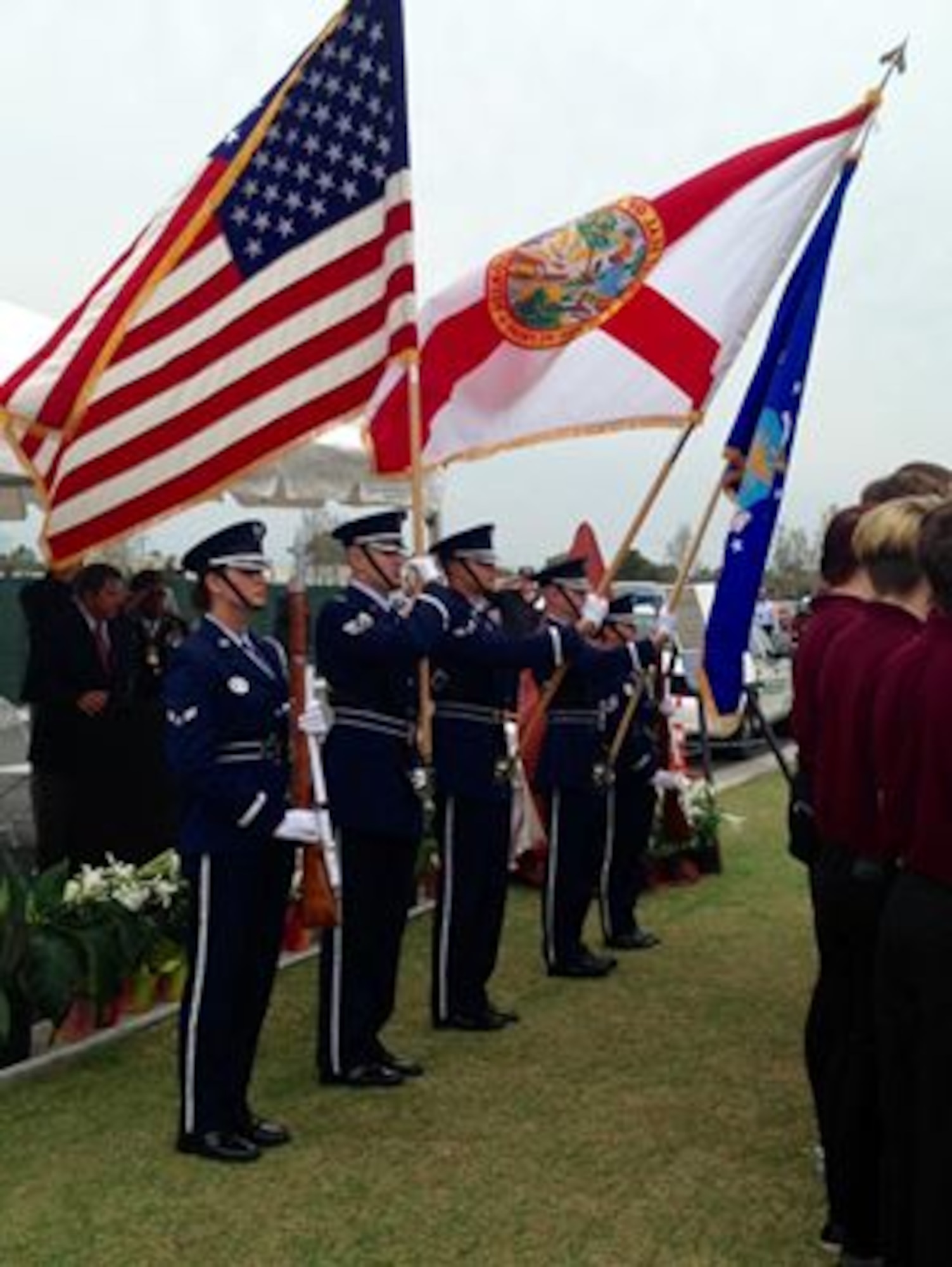Members of the Patrick Air Force Base Honor Guard present the colors during a Vietnam War Commemoration, 50th Anniversary, at the Cape Canaveral National Cemetery, March 29, 2016, in Mims, Fla. The Patrick AFB Honor Guard is an organization, which is congressionally mandated to provide military funeral honors for deceased Air Force, Army Air Force and Army Air Corps veterans, retirees and active duty personnel within the eastern half of Florida--from Volusia County to Miami-Dade. (U.S. Air Force photo/Heidi Hunt) (Released) 