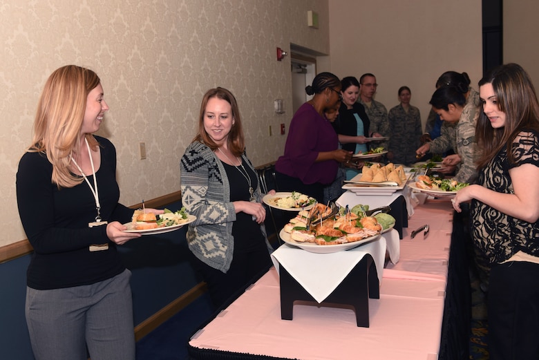 Members of Team V gather for a buffet-style luncheon honoring Women’s History Month, March 29, 2016, Vandenberg Air Force Base, Calif. With the month of March being steadily observed as Women’s History Month since the late 1980s, the luncheon served as an informal gathering at which guests could contemplate the positive impact women have made to the country -- through public and government service.  (U.S. Air Force photo by Staff Sgt. Shane Phipps/Released)