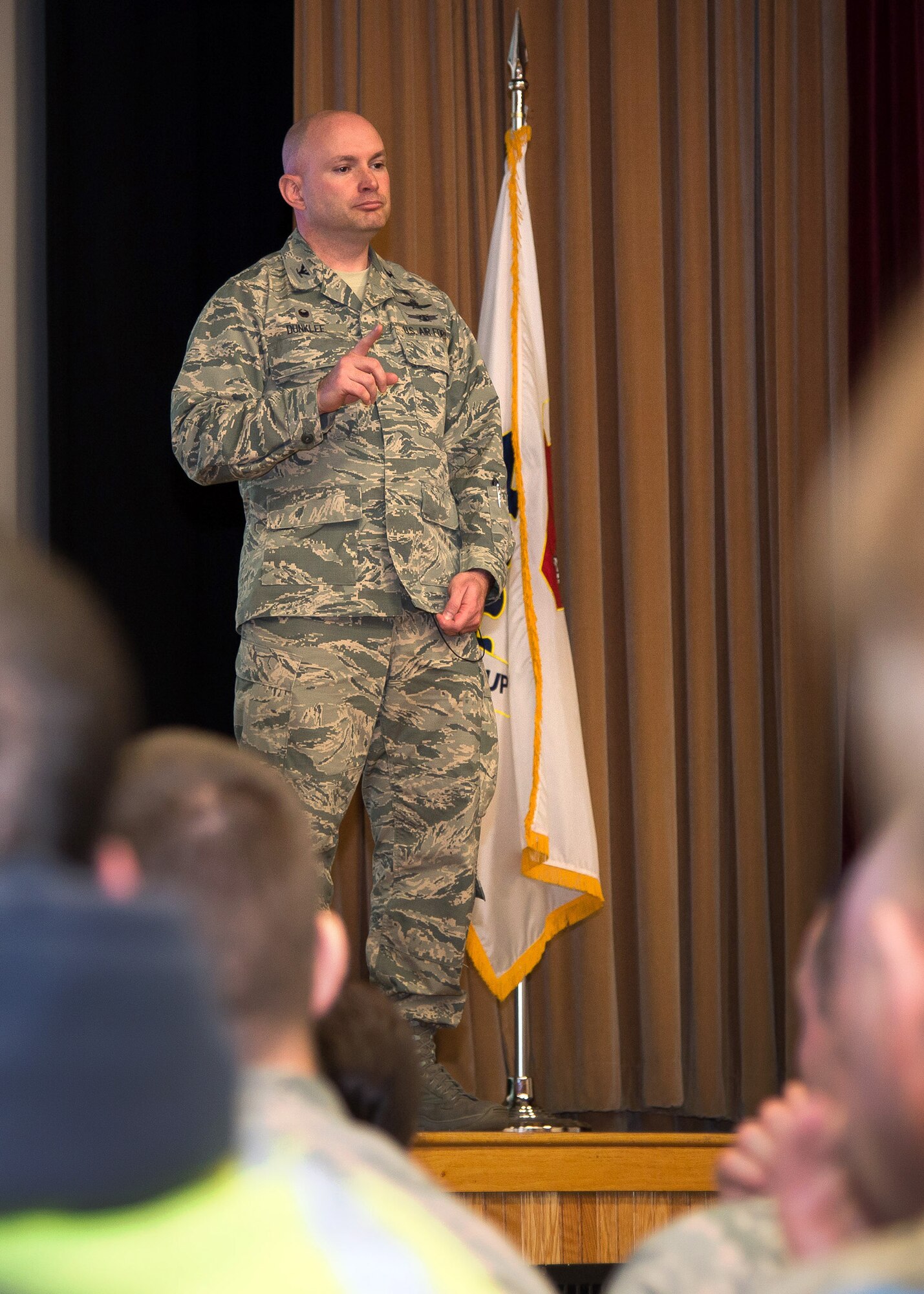 Col. David R. Dunklee, 66th Air Base Group commander, speaks to members of the ABG at a commander's call in the base theater March 29. During the commander's call, Dunklee recognized members of the air base group, discussed the group's strategic plan and more. Members of the workforce also received briefings from Battle Management and C3I and Networks Directorates. (U.S. Air Force photo by Mark Herlihy)