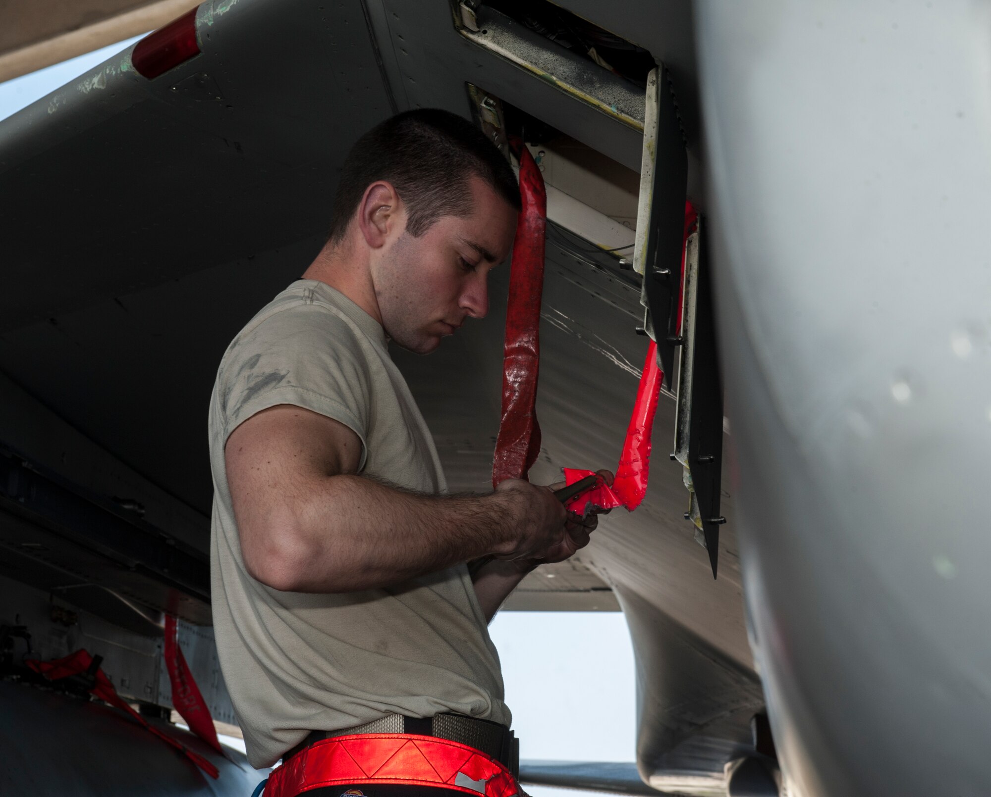 U.S. Air Force Senior Airman Kory Joseph, 18th Aircraft Maintenance Squadron weapons load crew member, inspects a clamp before installing it in an M61A1 gun March 29, 2016, at Kadena Air Base, Japan. The M61A1 gun is capable of firing 6,000 rounds per minute, making it an invaluable part of the F-15 Eagle. (U.S. Air Force photo by Airman 1st Class Lynette M. Rolen)