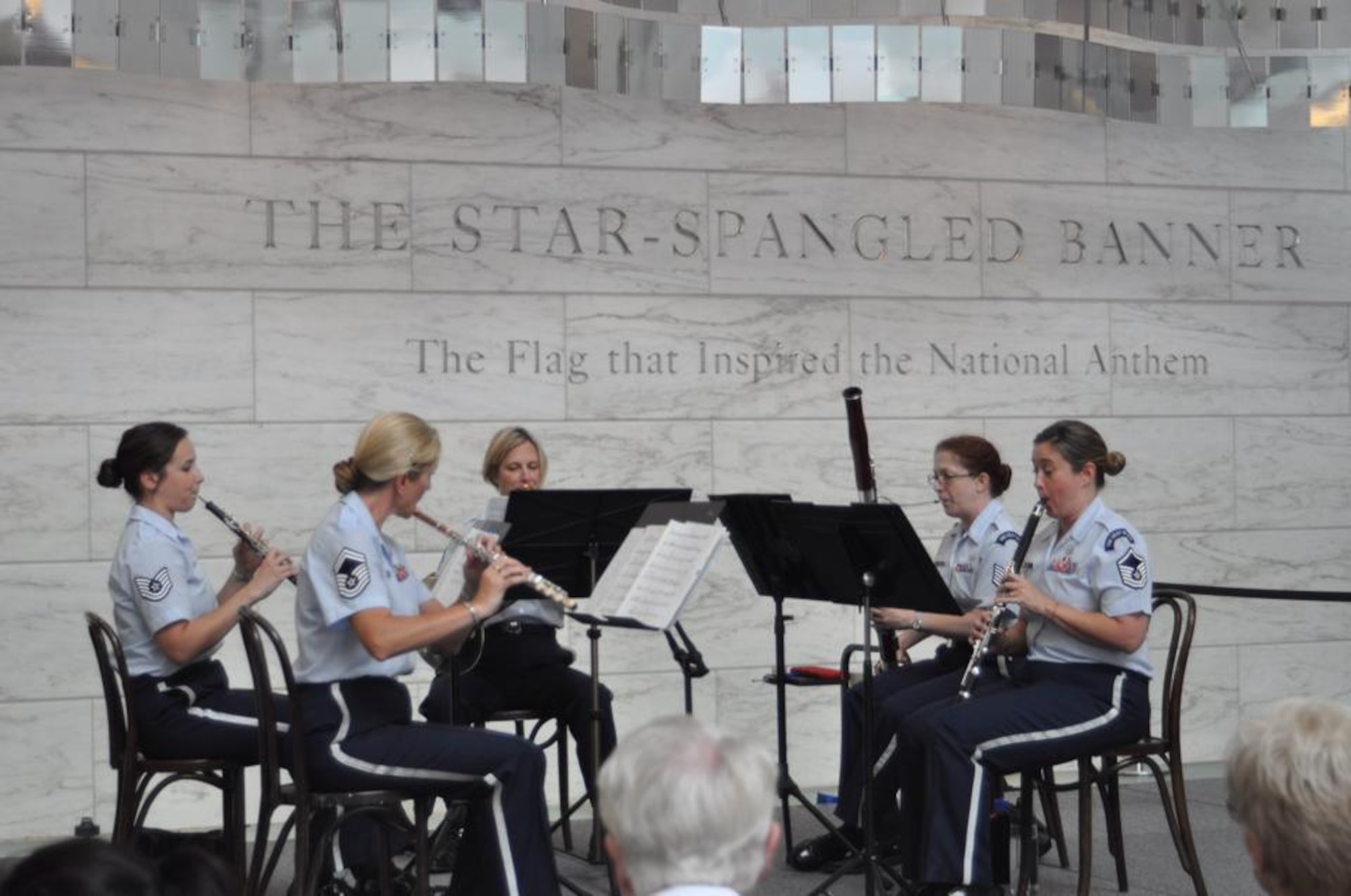 The U.S. Air Force Band Woodwind Quintet entertains visitors at the Smithsonian's National Museum of American History. March is Women's History Month, and The U.S. Air Force Band celebrates its heritage as it looks toward its future. (U.S. Air Force photo/released)