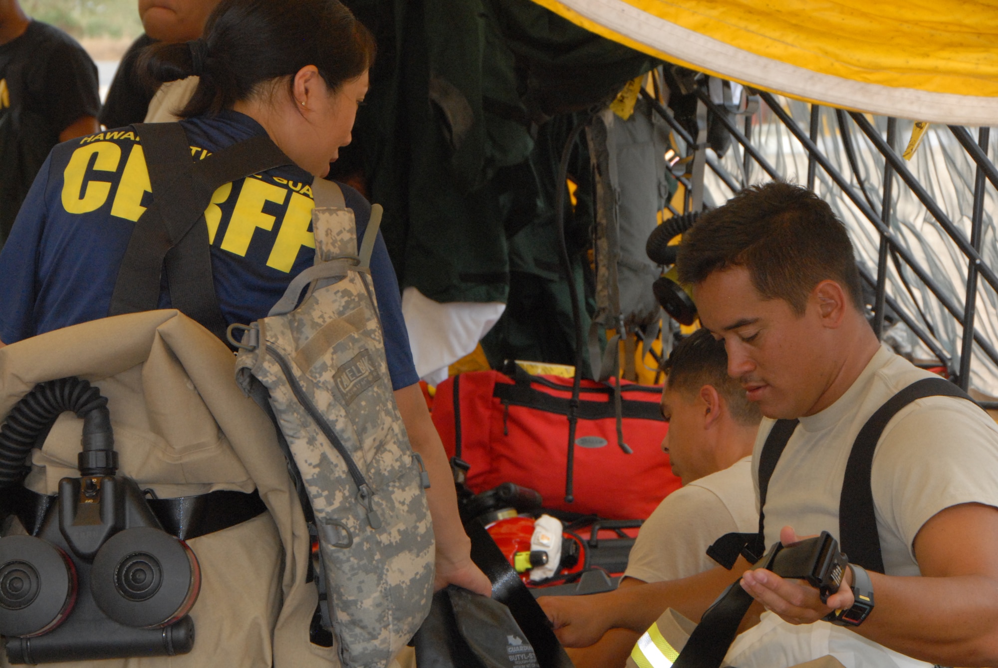 Airmen from the Hawaii Air National Guard's Detachment 1, Headquarters 154th Medical prepare for search and rescue scenarios during a Collective Training Exercise at Kalaeloa, Hawaii, Mar. 23, 2016. This was the first CTE since the unit was stood up in Nov. 2015. The exercise was designed to test the Hawaii National Guard’s Chemical, Biological, Radiological, Nuclear and Explosive Enhanced Response Force Package. (U.S. Air National Guard photo by Senior Airman Orlando Corpuz/released)