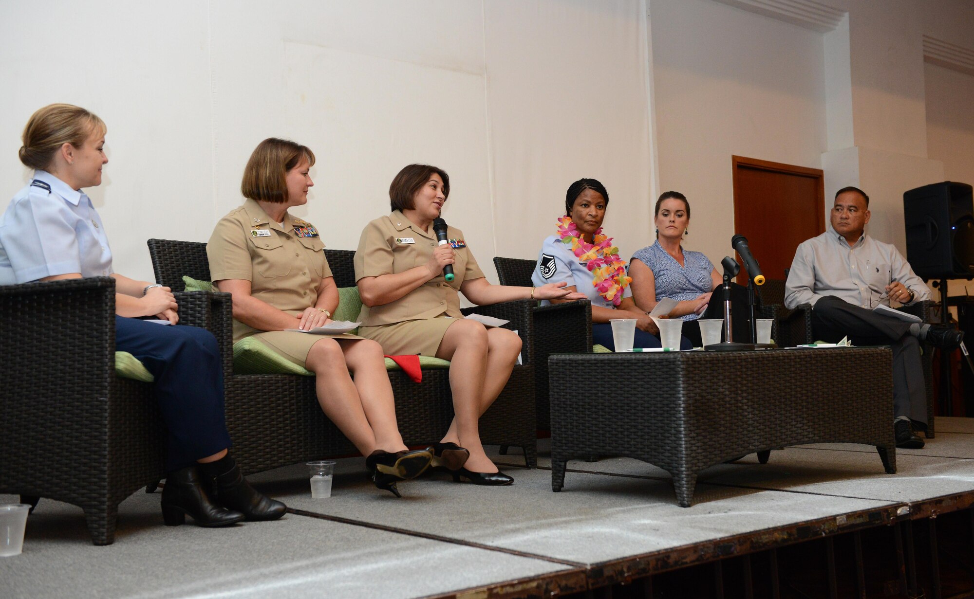 Panel members gather on stage during the Joint Women Leadership Symposium March 24, 2016, in Tumon, Guam. The focus for JWLS was to empower women and men with the tools necessary to find their voice and work on leadership skills. (U.S. Air Force photo by Airman 1st Class Arielle Vasquez/Released)