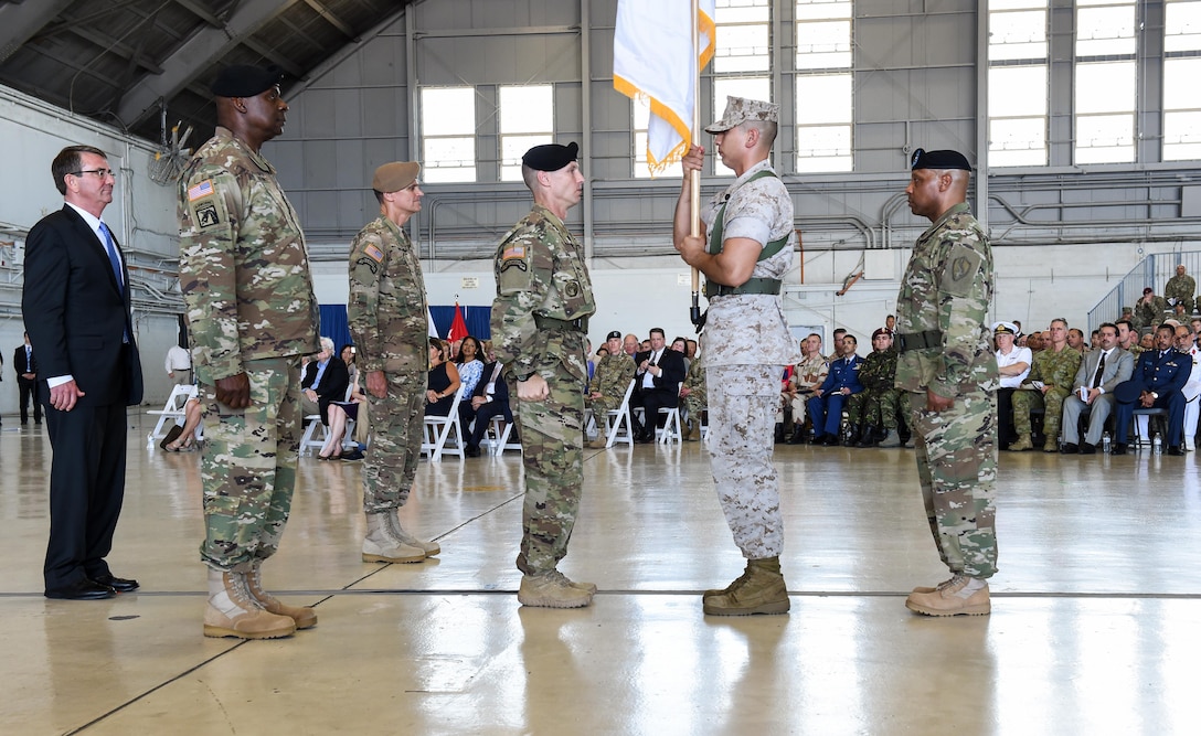 From left to right: Defense Secretary Ash Carter; Army Gen. Lloyd J. Austin III, outgoing commander of U.S. Central Command; Army Gen. Joseph L. Votel, incoming commander, stand at attention during Centcom's change-of-command ceremony at MacDill Air Force Base, Fla., March 30, 2016. DoD photo by Army Sgt. 1st Class Clydell Kinchen