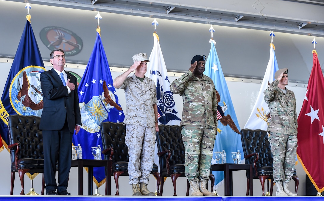 From left to right: Defense Secretary Ash Carter; Marine Corps Gen. Joe Dunford, chairman of the Joint Chiefs of Staff; Army Gen. Lloyd J. Austin III, outgoing commander of U.S. Central Command; and Army Gen. Joseph L. Votel, incoming commander, render honors during Centcom's change-of-command ceremony at MacDill Air Force Base, Fla., March 30, 2016. DoD photo by Army Sgt. 1st Class Clydell Kinchen
