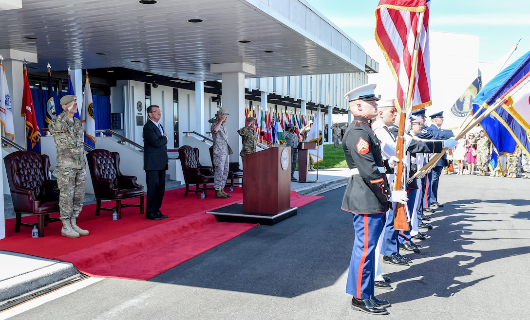 From left to right: Army Gen. Joseph L. Votel, left, outgoing commander of U.S. Special Operations Command; Defense Secretary Ash Carter;  Marine Corps Gen. Joe Dunford, chairman of the Joint Chiefs of Staff; and Army Gen. Raymond A. "Tony" Thomas, incoming commander,  render honors during the change-of-command ceremony at MacDill Air Force Base, Fla., March 30, 2016.  DoD photo by Army Sgt. 1st Class Clydell Kinchen