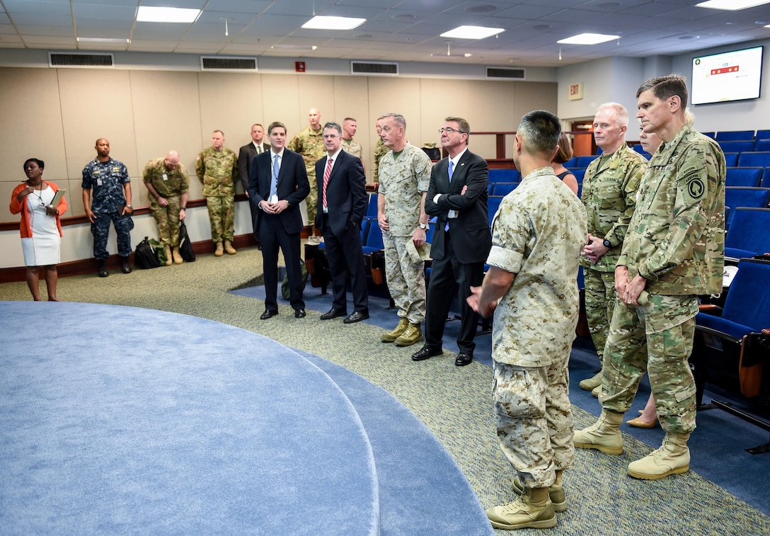 Defense Secretary Ash Carter; Marine Corps Gen. Joe Dunford, third from left, chairman of the Joint Chiefs of Staff; Army Gen. Raymond A. "Tony" Thomas, fourth from left, the new commander of U.S. Special Operations Command; and Army Gen. Joseph L. Votel, second fro left, the outgoing commander, attend a briefing before the Socom change-of-command ceremony at MacDill Air Force Base, Fla., March 30, 2016. DoD photo by Army Sgt. 1st Class Clydell Kinchen